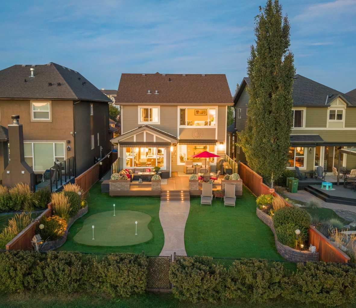 Welcome to 35 Cranarch Terrace – an executive residence in the highly sought-after community of Cranston. Perfectly positioned along Cranston’s Ridge, this home captures breathtaking, unobstructed views of the Bow River Valley, Fish Creek Park and the Rocky Mountains. With direct access to endless walking and biking trails, it offers the ideal blend of natural serenity and urban convenience. Step inside to a bright, open-concept floor plan designed to emphasize space, light and comfort. The main level features soaring ceilings, expansive windows to showcase the panoramic views and a warm living room centered around a gas fireplace. The chef-inspired kitchen is both stylish and functional, complete with granite countertops, rich cabinetry, a large central island, stainless steel appliances, and a spacious walk-through pantry with a built-in dog door that connects seamlessly to the mudroom and garage. A dedicated office space and a dining area that extends to the large low maintenance deck—perfect for morning coffee or evening sunsets! Upstairs, the luxurious primary suite is a true retreat, offering a spa-like ensuite with dual sinks, a walk-in closet with built in shelving, a Mi-Berry Spa Hot Tub and separate shower. Two additional bedrooms, a full bathroom and a versatile bonus room provides plenty of room for family and guests. The upper level laundry comes with custom cabinetry and a drying rack which adds to everyday convenience. The backyard is designed for year round enjoyment, featuring professional landscaping, extra-large composite deck with glass privacy panels, artificial turf, and a private putting green for a low maintenance fun outdoor lifestyle. Additional highlights include an oversized heated double attached garage, Gladiator cabinets, workbench with a matching fridge and central air conditioning throughout the house. All this on a quiet, family friendly location close to schools, shopping, restaurants, the South Health Campus Hospital, and easy access to major roadways. With its spectacular views, elegant finishes, and thoughtful design, 35 Cranarch Terrace SE isn’t just a home it’s a lifestyle. Book your showing today!