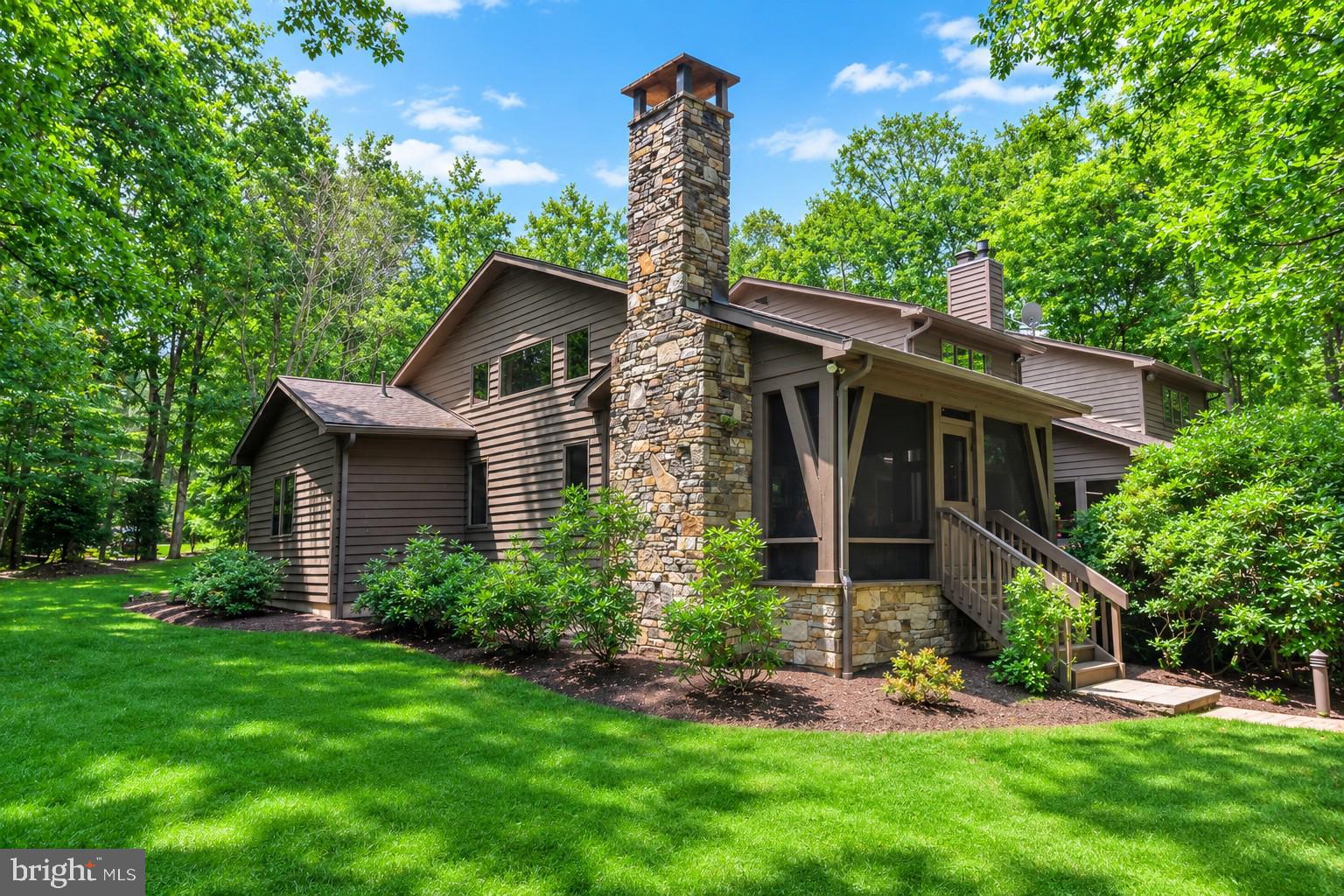 A rare opportunity to  own a lakefront property in the Blakeslee.  Located in one of best coves and communities on Deep Creek Lake, the 4 bedroom, 3.5 bath property offers the perfect home and lot package for the best in lakefront living.    The 1+ acre wooded property with 150' of premium frontage was the first building site purchased when the development opened .  The gently sloping wooded sunset facing lot provides easy access to the lake and dock areas.  The current owners have added multiple landscape upgrades including paver stone walkways along with lakeside picnic and fire pit areas.    A paved circular driveway provides easy year round access from the street.  With lake and summer sunset views from nearly every room,  the well designed home offers an open floor plan featuring plenty of window coverage.  The main level offers a recently upgraded kitchen and lake facing eating area.   A large lake facing great room with fireplace adjoins a cozy family room with its own fireplace and direct deck access.  The recently added primary bedroom suite includes a spacious bedroom, luxurious bath, 2 walk in closets and a bonus room currently used as an office.  The second floor includes a second primary suite and two spacious bedrooms along with a loft.    There is also a lower level with a room that could be a game and or work out area.     Many would consider the recently added lakeside covered porch with impressive wood fireplace their favorite spot.  It offers direct access to the new deck and primary suite.   The property also offers an attached 2 car garage and a detached 24 x 24 garage with plenty of interior height for boat and or tall vehicle storage.    Additional upgrades and features includes the addition of a  detached 2 car garage, complete deck replacement, whole house generator, replacement and updated  HVAC and security systems.   The roof shingles have also been recently replaced .  Blakeslee is considered by many to be the finest community in the Deep Creek Lake area.  The developers believed quality was more important than quantity and designed a community with great amenities and over 100 acres of open space that is restricted from additional development.   Blakeslee has also attracted a healthy mixture of full time and vacation owners.   The self managed community offers many unique amenities.   These amenities include a community center with indoor heated pool, locker rooms, kitchen and decking.   Two tennis courts along with a basketball and pickleball courts are well maintained .  A multipurpose field is available for outdoor games.  A trail system runs through the wooded areas for area residents.  Other important features include a storage areas for boats and trailers along with a dedicated trash removal area.  It all adds up to a a great opportunity to experience all the benefits that home ownership in the Deep Creek Lake area has to offer.  Schedule your showing today as homes for sale in this community typically don't last long.