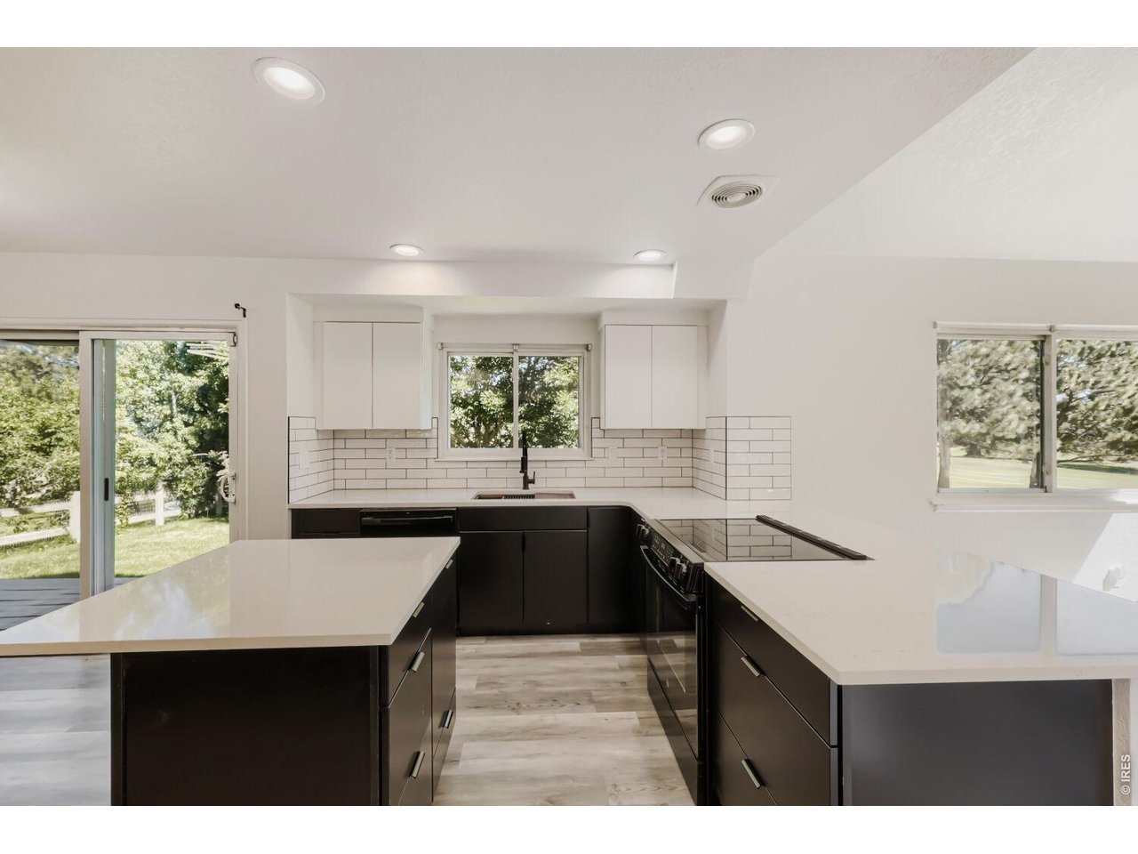 ONE year interest rate buy down by owner, see BR. WOW A must to see. Upgraded inside and out. Welcome to Your Dream Home on the 9th Fairway of Indian Peaks Golf Course! As you enter this charming, tree-lined neighborhood, you'll immediately fall in love. You're first greeted by a beautiful community park featuring a kids' play area and basketball court - the perfect place to relax, play, and connect with neighbors. Step inside to a spacious light-filled living, dining area with vaulted ceiling that go up to the second floor. This is open to the kitchen with large quartz entertainment bar. The large kitchen has been totally remodeled with white and black flat no pull cabinet and quartz counter top, black sink, with no touch faucet.and new black appliances (plans in mls ) w/ breakfast nook, seamlessly opens into the family room - all overlooking the lush green 9th fairways. Private study, has lovely views of the front yard - working from home and enjoy it. Upstairs, the expansive MBS with new flat service cabins and quartz counter, black sink and fixtures, new shower stall with nooks and accent stripe. Steeping Bathtub features large windows with golf course views. Five-piece bath, and a walk-in closet, creating a peaceful and luxurious escape. The two other bedrooms have also been refreshed and share a new bath with flat white cabins and quartz counter top new tub and tile with nook, and accent stripe. The finished basement is perfect for family member or to hosting guests, with a large recreation room, a wet bar, a spacious bedroom. Private exterior entrance via a covered stairway. A large unfinished storage area will keep everything organized.Freshly repainted inside (snowbound white) and outside with a modern look (Pure white body with Peppercorn trim), looks brand new. Newer high-efficiency furnace, and HWH ensuring comfort and energy savings year-round. Come visit this beautiful home, imagine your life surrounded by nature, community, and golf course living.