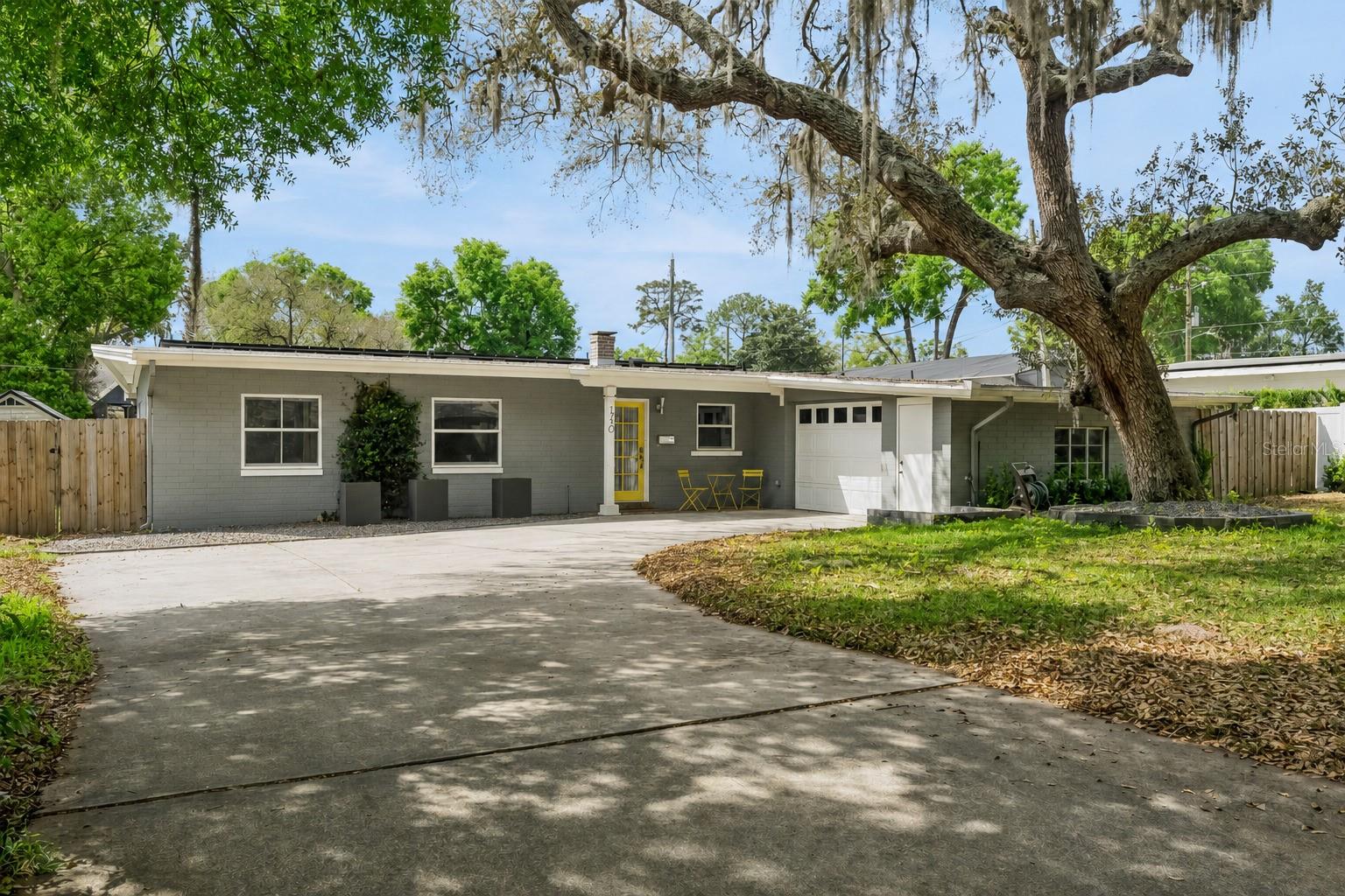 Set along a quiet, tree-lined street in Maitland, this 3 bedroom, 2 bathroom home with 1,922 square feet captures the essence of mid-century modern design with a fresh, updated edge. Clean lines, open flow, and a strong connection to the outdoors define the home from the moment you step inside.  Major updates include the kitchen in 2019, bathrooms in 2021, Roof 2022, and HVAC in 2024.  The living spaces feel intentional and uncluttered, with natural light highlighting the architectural simplicity that makes this style so enduring. An updated kitchen anchors the home with modern finishes and functionality, complemented by an eat-in dining area that invites everyday gathering. A dedicated bar area adds character and ease for entertaining, creating a space that feels both relaxed and refined.A separate office/flex space provides flexibility for today’s lifestyle, offering a quiet place to work or create without disrupting the flow of the home. Updated bathrooms carry a cohesive, minimalist design throughout, staying true to the home’s architectural roots.The outdoor space continues the story. Minimalist landscaping and open, usable areas create a calm and private setting that feels like a natural extension of the interior. It is a setting designed for both quiet mornings and easy evenings with friends.An optional HOA provides deeded lake access, adding a lifestyle component that is increasingly hard to find. All of this is paired with access to some of the most highly regarded schools in Central Florida and a location just minutes from Park Avenue, dining, and shopping.This is not just a home with style. It is a home with intention.