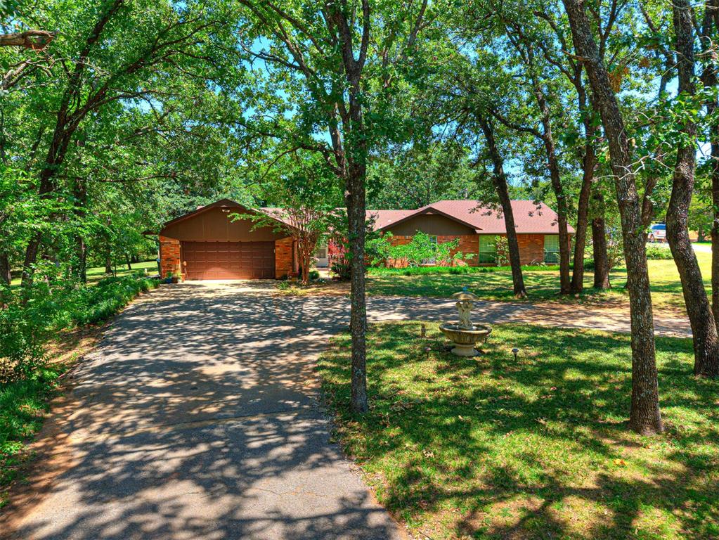 Beautiful family home conveniently located minutes from Norman .and Lake Thunderbird!  Country charm meets city convenience! Tucked away on 2.3 beautiful, cornered tree-covered acres, this inviting 4-bedroom, 2-bath home offers the perfect blend of comfort, privacy, and functionality. Inside you’ll find two spacious living areas, while outside you’ll enjoy a large working fountain in the circle drive, a covered patio, a tranquil stocked koi pond, a large workshop, screened porch, circle drive, and plenty of room to roam. Located just minutes from Norman with easy access to Highway 9, this property offers the peaceful lifestyle you’ve been searching for without sacrificing convenience. Come experience all this unique property has to offer! Alarm system with cameras and motion detectors. Buyer to verify schools and all information