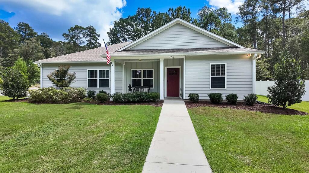 Close to downtown, schools, and shopping! Welcome to 200 Knotted Pine Lane in Pine Summit Subdivision, a home that makes everyday living feel easy. Set on a corner lot in an established Thomasville neighborhood with no HOA, this 4 bedroom, 2.5 bathroom home offers the space you want with a location that keeps everything close. Schools, downtown Thomasville, grocery shopping, dining, and more are all within about five miles.  The open, split floor plan is designed for both gathering and having your own space, with the main living areas flowing together while the bedrooms are thoughtfully separated. Whether it's a busy weekday morning or a laid-back weekend at home, the layout feels comfortable and functional.  The screened-in porch is the kind of space you'll actually use, perfect for morning coffee, quiet evenings, or dinner outside. Just beyond it, the gravel patio is ready for a firepit and a few chairs, creating an easy outdoor hangout space. A two-car garage adds plenty of convenience, while the corner lot gives the home a little extra openness.  If you're looking for a home that feels comfortable, functional, and close to everything Thomasville has to offer, this home has a great balance of neighborhood living, modern convenience, and everyday ease.