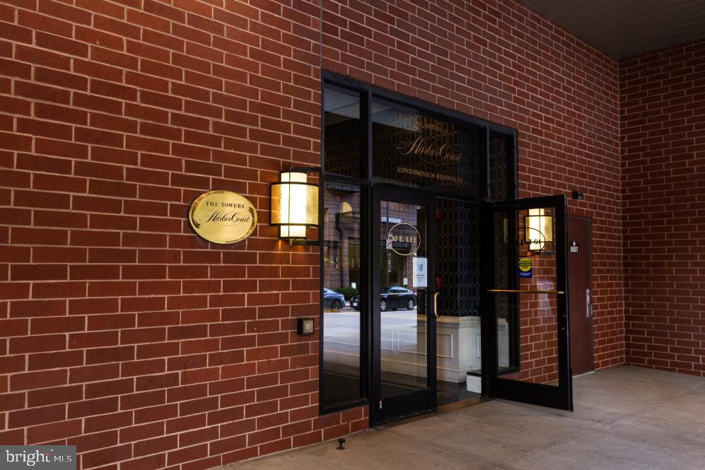 Experience elevated waterfront living at its finest in this 12th-floor residence at the prestigious Towers at Harbor Court.  This 2-bedroom, 2-bathroom condo spanning 1,571 square feet delivers panoramic Inner Harbor views from every room framed by dramatic bay windows, a spacious open concept with an abundance of natural light streaming through.  A gracious entry with marble flooring opens into an expansive, light filled living space.  The gourmet kitchen is equipped with top-of-the-line appliances, plenty of cabinetry and a pass through bar creating a seamless flow between the expansive living and dining creating an ideal environment for both high-end entertaining and quiet relaxation against an iconic backdrop. The primary suite serves as a private sanctuary featuring a walk-in closet and wardrobe.  A spa-inspired en-suite bath and a gorgeous view of the Inner Harbor, while the second bedroom with hardwood flooring offers versatility as a guest room or a professional home office.  Enjoy the convenience of in-unit laundry with both a washer and dryer, making everyday tasks effortless. The outdoor courtyard invites you to enjoy the beauty of the patio garden or work on your basketball skills or pickleball game.  Life at Harbor Court is defined by world-class service and convenience, featuring 24/7 concierge, doorman, and porter services. Unit includes a secured garage parking space, basic cable and water.  Through a secure indoor connection to the adjacent Royal Sonesta Hotel access premium fitness facilities, an indoor pool, and sauna via an optional membership (paid by tenant).   With a nearly perfect walk score, you are just steps from the Inner Harbor promenade, Federal Hill, Fells point, M & T Stadium, Camden Yards or CFG Bank Arena and endless restaurants. This ideal location offers quick and easy access to I95, 395, 83 and a short walk to the MARC Train (Camden Yards Station).