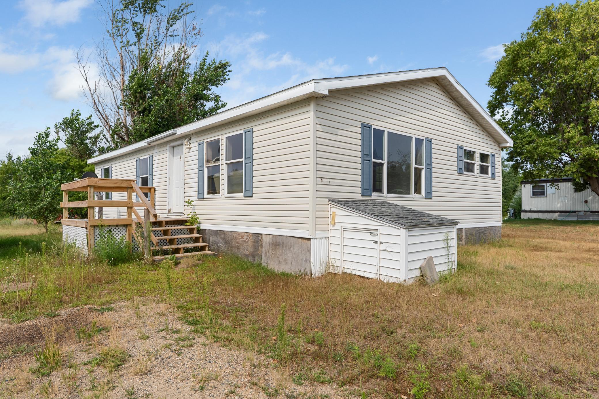 Looking for an affordable home with potential? This 3-bedroom, 2-bath manufactured home, built in 2006, sits on nearly a half-acre in a peaceful country setting just minutes from town. With a surrendered title and hurricane tie-downs already in place, this property offers financing advantages that many manufactured homes do not.Whether you're a first-time homebuyer looking to build equity or an investor searching for your next project, this property presents a great opportunity. The home could benefit from some updates and TLC, allowing you to make improvements over time while adding value. Enjoy the extra outdoor space, quiet surroundings, and convenient access to nearby amenities. If you've been looking for an affordable property with room to grow, this one is worth a look.