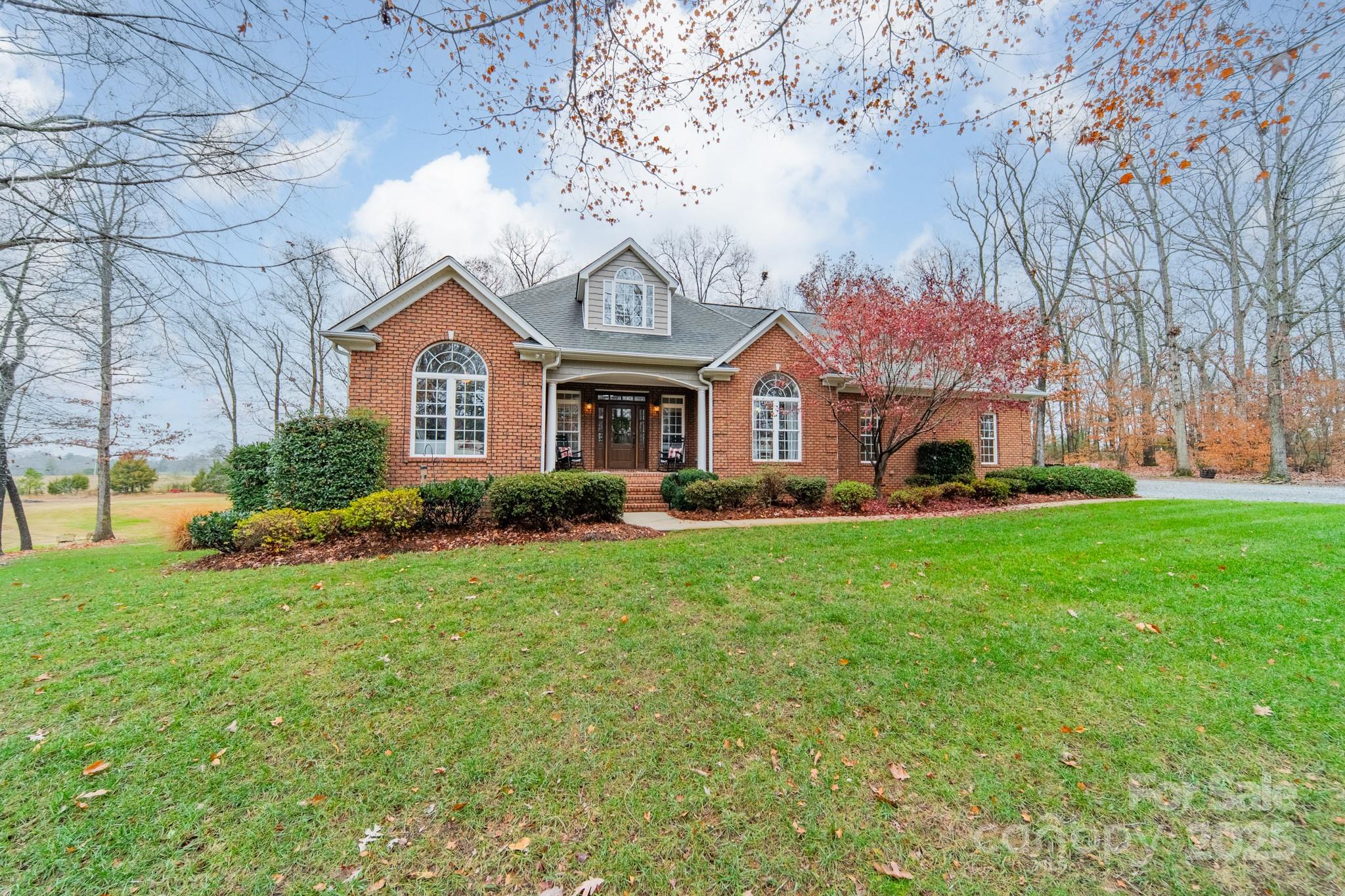 Welcome to your dream home in the heart of Mt. Pleasant! This beautifully designed 2-bedroom, 3-bathroom full brick home offers versatile living options, with multiple rooms that can function as a third or fourth bedroom, a home office, or a playroom.  This home has over 3,000 sq ft nestled on 5.84 acres, which is a perfect blend of wooded tranquility and is ideal for outdoor activities, privacy, and enjoying nature's beauty.  Step inside to a warm and inviting living room highlighted by a stunning stone gas log fireplace and vaulted ceilings. The kitchen features a bar that opens the breakfast nook to the living area, creating a semi-open floor plan with an easy, connected flow. You'll also enjoy a separate formal dining room, perfect for hosting larger gatherings. The home showcases numerous upgrades, new HVAC, beautifully refinished hardwood floors, and a large laundry room with abundant storage, which provides added convenience and organization. The oversized primary bedroom features a customized closet system, while the primary bathroom offers a spacious walk-in shower and garden tub. Enjoy the spacious deck and screened-in porch, perfect for entertaining or relaxing after a long day. The fully finished basement adds exceptional versatility, complete with a second kitchen and generous additional living space.  Atrium doors open to a patio, extending your options for outdoor enjoyment. For car enthusiasts, the impressive 1800 sq ft, detached four-car garage is fully climate-controlled and enhanced with spray insulation and LED lighting for comfort and efficiency. This remarkable space is ideal for storing or working on cars and can function as a workshop or adapt to nearly any need. Just minutes away from downtown Mt. Pleasant, you'll have easy access to a variety of local restaurants, fine dining, a distillery, and shops, ensuring that everything you need is right at your fingertips This one-of-a-kind property combines luxury, privacy, and functionality. Your dream home awaits. Schedule your showing today!