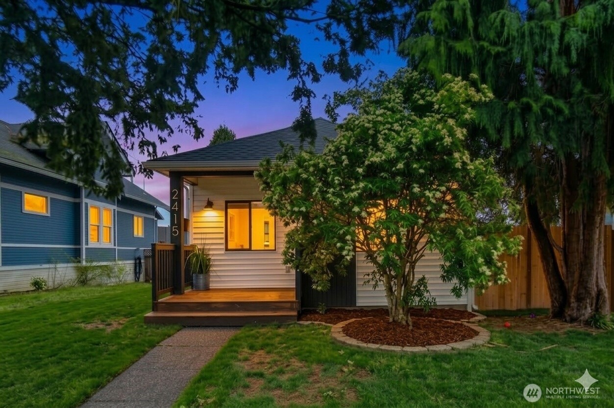 Welcome to this beautifully updated rambler on a charming tree-lined street. A new cedar front porch welcomes you into a bright, open-concept home featuring 3 bedrooms and a custom-designed bathroom. Recent updates include electrical, plumbing, heating, windows, fresh interior and exterior paint, and new luxury vinyl plank flooring throughout. High ceilings and large windows fill the home with natural light, while a recessed electric fireplace adds warmth and style. Stay comfortable year-round with a Mitsubishi mini-split system providing efficient heating and A/C. Enjoy the new deck overlooking the landscaped yard, plus a designated parking space behind the home and additional parking in front. Basement offers extra storage. Conveniently located minutes from downtown Everett, I-5, restaurants, and the Everett Transit Station.