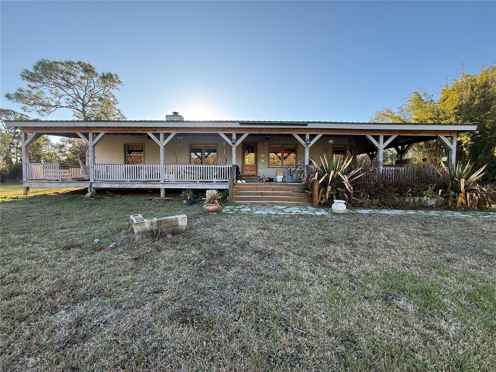 Beautiful 5-acre rural property located in Okeechobee County, 3 Bedroom 2 bath home offering the perfect blend of privacy and accessibility. This spacious parcel provides ample room for a custom home, mobile or manufactured home (subject to county approval), animals, gardens, and additional structures. The property is situated on a quiet road with a peaceful country atmosphere yet remains conveniently located within a short drive to downtown Okeechobee. Ideal for buyers seeking a rural lifestyle, investment opportunity, or future homesite with plenty of space to grow and enjoy Florida living with 2 ponds. Also, a pole barn and workshop with lots of storage space as well!