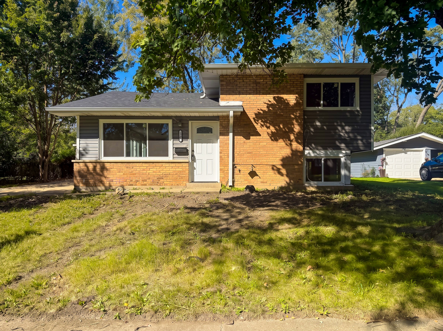 This charming split-level single-family home features 3 bedrooms and 2 full baths. The bright, open-concept main level seamlessly connects the living and dining areas to the kitchen, making it perfect for both daily life and entertaining. Upstairs, you will find three spacious bedrooms and a full bath. The lower level offers a cozy family room, a second full bath, and a convenient separate utility and laundry room. Filled with natural light, this inviting home also includes a private driveway, a 2-car garage, and a large backyard ideal for outdoor activities. Plus, it is just a short walk to local parks and the Michelle Obama School of Technology and the Arts.