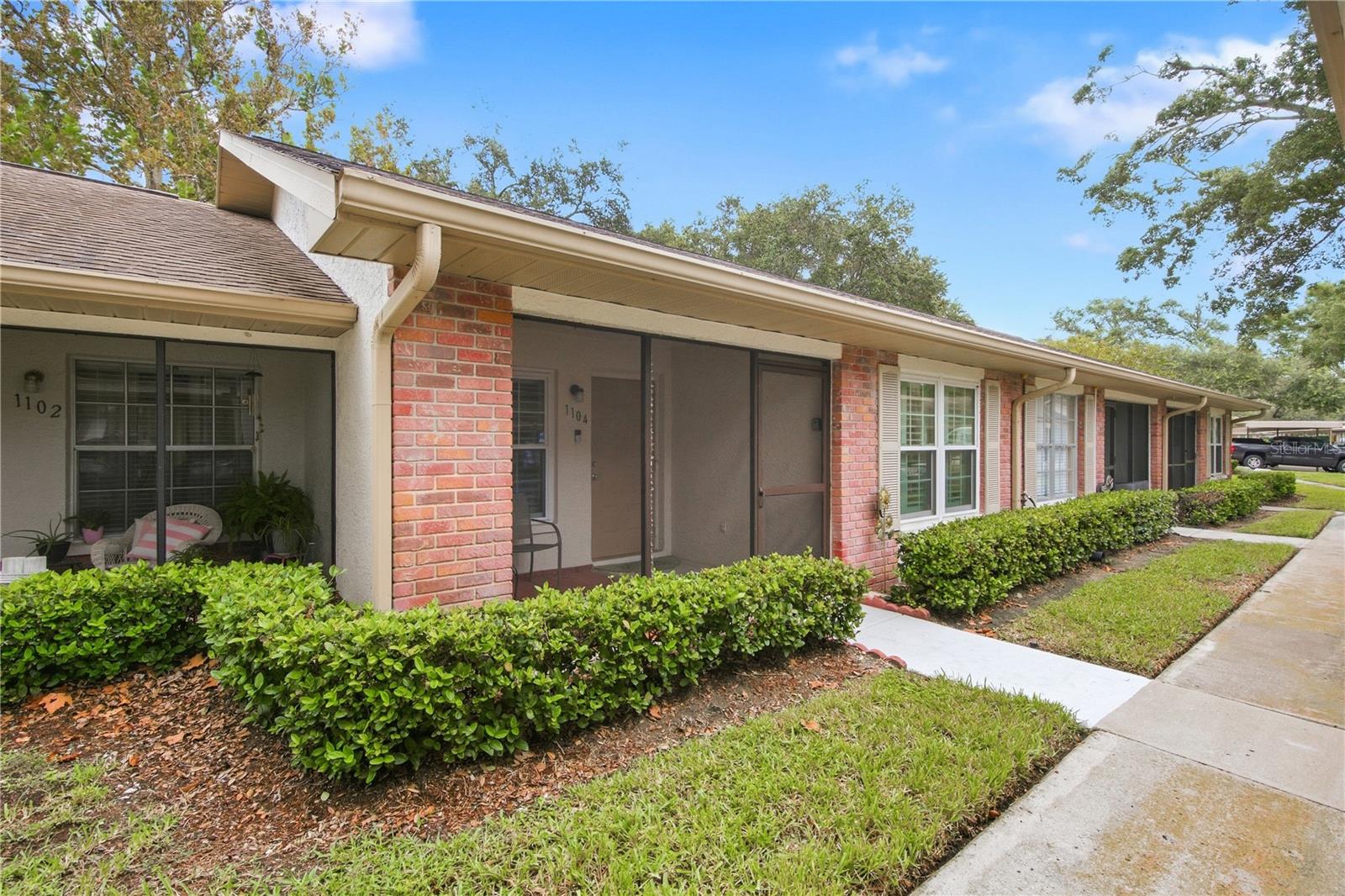 Welcome to Scotsdale Villas III, a beautifully maintained 55+ community offering a peaceful, park-like setting in the heart of Dunedin. This move-in-ready, first-floor 2-bedroom, 1-bath villa offers 680 square feet of thoughtfully designed living space, combining extensive updates with low-maintenance Florida living.An inviting screened front porch welcomes you inside to a comfortable, well-maintained interior featuring ceiling fans, insulated Louverwood shutters, and a practical layout that makes excellent use of the space.The completely renovated kitchen features granite countertops, updated cabinetry, and beautiful conch ash-colored flooring. Hurricane-rated windows and a hurricane sliding glass door provide added peace of mind while filling the home with natural light. The sliding door opens to a screened rear patio, creating a private spot for morning coffee or relaxing at the end of the day.Both bedrooms are comfortably sized, while the beautifully renovated bathroom features a granite countertop and custom glass shower door enclosing the walk-in shower with grab bars. A stackable washer and dryer adds everyday convenience, and an outdoor storage closet provides additional space. The air-conditioning system is approximately two years old, and the home is available furnished or unfurnished.The $610 monthly HOA fee includes water, sewer, trash, internet, basic cable, roof and lawn care, property insurance, exterior pest control, and recreational amenities. Residents enjoy a clubhouse, two swimming pools—one heated—shuffleboard, sidewalks, and designated covered parking right out front. New pickleball courts are scheduled to replace the existing tennis courts in October 2026. The HOA also permits approved energy-efficient improvements, including electric-vehicle chargers and solar panels.Just beyond the community, Scotsdale Park offers walking trails, picnic areas, a scenic lake, and pavilion. And when it comes to location, this home puts some of the best of Dunedin within easy reach.Historic Downtown Dunedin is just minutes away, where locally owned boutiques, restaurants, craft breweries, waterfront destinations, farmers markets, and year-round festivals create the distinctive small-town atmosphere that makes Dunedin such a special place to call home. Baseball fans will appreciate being close to the Toronto Blue Jays spring training stadium, while outdoor enthusiasts can explore the Pinellas Trail and the area's many parks and recreational opportunities.When the beach is calling, the Dunedin Causeway provides easy access to Honeymoon Island and the beautiful waters of the Gulf, while Clearwater Beach is also within convenient reach. With downtown Dunedin, recreation, beaches, shopping, dining, and everyday conveniences all nearby, this villa offers an exceptional opportunity to enjoy the relaxed Florida lifestyle.Whether you're looking for a full-time residence or an easy-to-maintain Florida retreat, this beautifully updated Scotsdale Villas III home is ready for its next chapter. Schedule your private showing today!