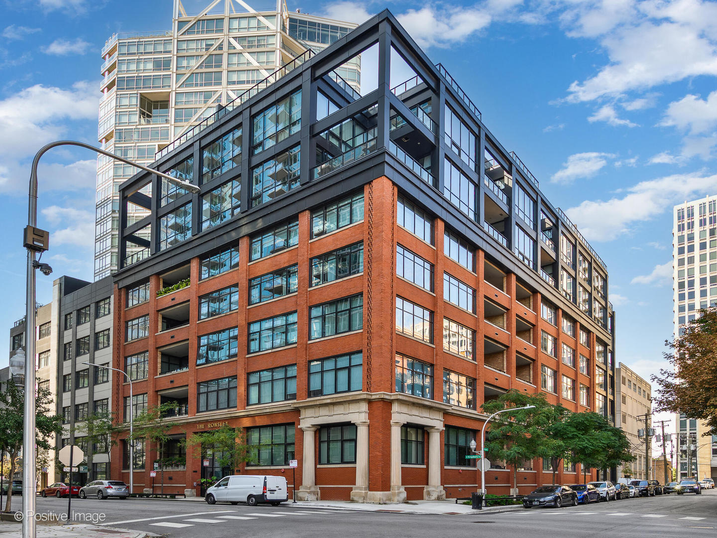 Experience elevated loft living at The Ronsley, one of River North's most sought-after luxury residences. This exceptional 3-bedroom, 3-bathroom home offers a perfect blend of industrial and modern feel, featuring soaring 15-foot timber ceilings, exposed brick, floor-to-ceiling windows, hardwood floors, custom lighting and automatic shades throughout. The open concept living and dining area is filled with natural light and anchored by a custom media wall, seamlessly flowing to a spacious private terrace. The chef's kitchen is outfitted with top-of-the-line Wolf appliances, a large island with polished quartz countertops, custom cabinetry, beverage refrigerator, pantry, and a custom designed built-in breakfast nook. A desirable split-bedroom floor plan offers convenience with each bedroom featuring a full en-suite bath. The luxurious primary suite includes oversized windows with blackout shades, a walk-in closet, and a spa-inspired bath with a steam shower, soaking tub, dual vanities, and updated mirrors. The generously sized second and third bedrooms each offer ample closet space and beautifully appointed en-suite baths. Additional features include a spacious laundry room with side-by-side washer/dryer, utility sink, and extensive cabinetry. The Ronsley is a full amenity building offering 24-hour door staff, fitness center, yoga room, resident lounge, an expansive landscaped courtyard with grilling stations, fire pit, and lounge seating and a private dog run. Ideally located near Montgomery Ward Park, the Chicago Riverwalk, Larrabee dog park, Health/Wellness Clubs such as East Bank Club and Bian, Target, groceries, top dining, nightlife, shopping, public transit and highway access. Price includes a premium deeded garage parking space with a lift accommodating two vehicles.