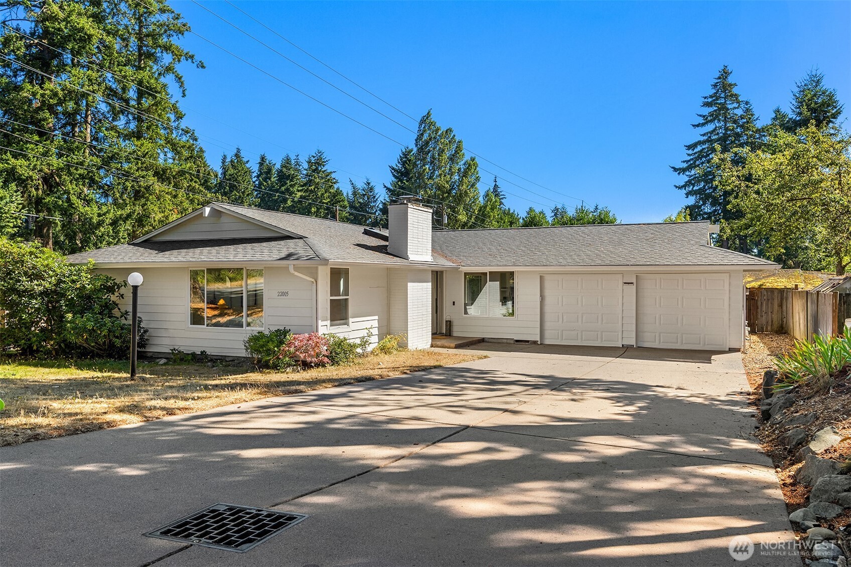 Completely remodeled Edmonds rambler on a quiet cul-de-sac!  This bright, fresh and distinctive 3-bedroom, 2-bath rambler comes complete with a separate finished backyard office adding even more flexible space.  This freshly remodeled home features vaulted ceilings, brand-new skylights, exposed beams, shiplap, refinished hardwood floors and a wood fireplace, giving the home an open, warm feel from the moment you walk in. The all-new kitchen features white shaker cabinetry, quartz countertops and updated lighting, while the remodeled primary suite includes a dual-sink marble vanity and walk-in shower. Fresh interior and exterior paint and a new water heater add to the move-in-ready appeal.  The fully fenced, level backyard features mature trees and landscaping, established vegetable and herb gardens, a sunny patio and the finished 120-sq-ft modern office with hardwood floors, power and spray-foam insulation—creating a private retreat with space to work, unwind and enjoy.  Set on a quiet cul-de-sac with an attached two-car garage and expansive driveway, plus convenient access to I-5 and Sounder Train for commuters, this is a home that’s best experienced in person."