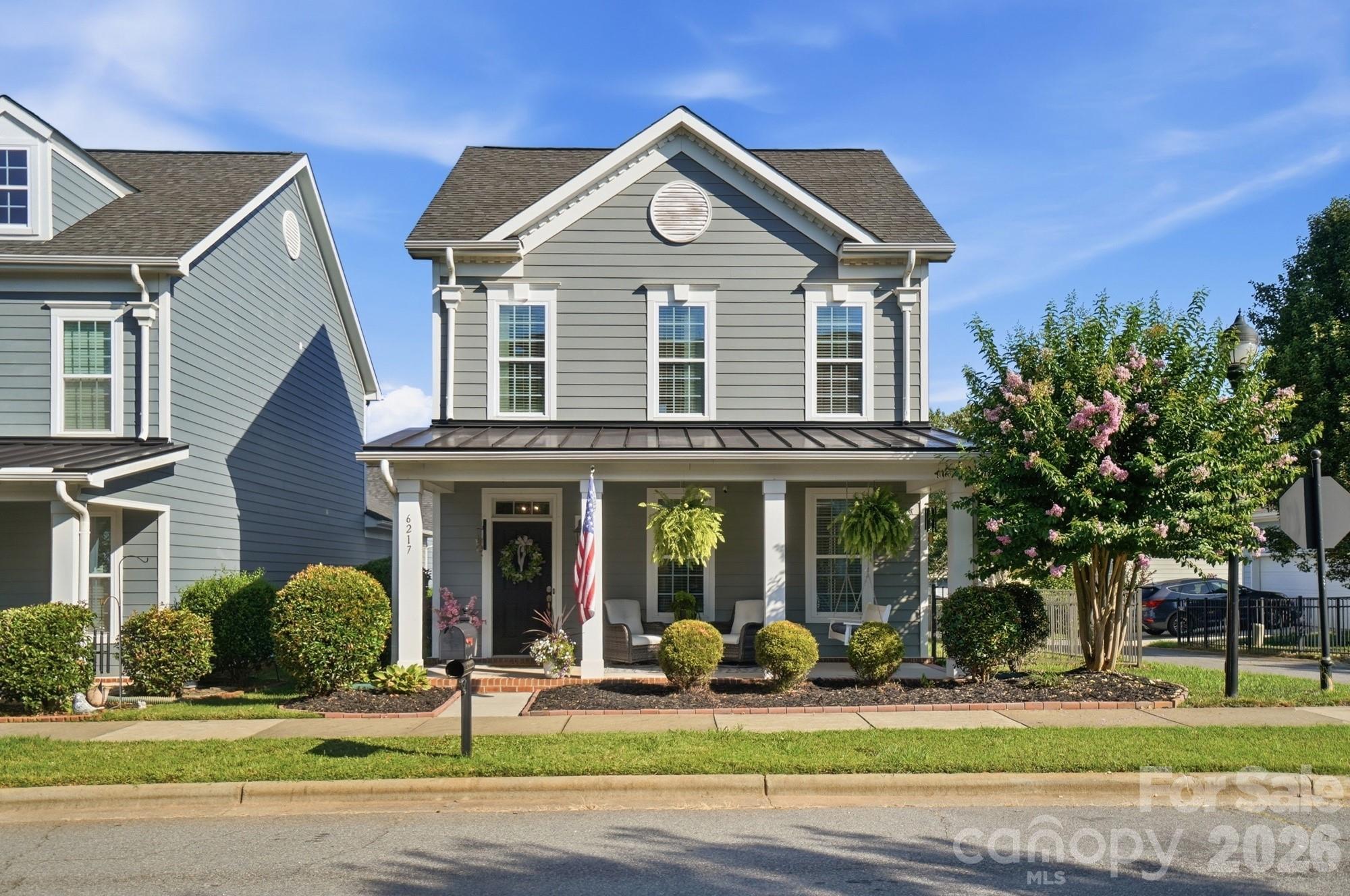 Welcome home to the charm and convenience of Brighton Park, where inviting front porches and friendly neighbors create a true sense of community.  Imagine mornings with coffee on the rocking chair front porch!  Inside, this thoughtfully designed home offers the ease of main-level living with a spacious primary suite down, featuring a beautifully tiled walk-in shower with bench, separate dual vanities, and an oversized walk-in closet.  Wood floors, upgraded lighting and Bose surround sound add warmth and comfort throughout.The kitchen is designed to inspire, with quartz countertops, stainless steel appliances, a five-burner gas cooktop, and a refrigerator that conveys – perfect for everything from weeknight dinners to entertaining family and friends.  Upstairs, 2 additional bedrooms and a loft provide flexible space for working from home, a fitness area or media room. Located in the heart of Mint Hill, in highly sought-after Brighton Park, you’ll love being just a short stroll from local restaurants, Publix, Harris Teeter, library and beautiful Ezell Park, where pickleball courts, basketball courts, a community garden, walking trails and a splashpad make it easy to enjoy the best of downtown Mint Hill.  The added bonus – convenient to Charlotte Douglas International Airport and all that Uptown Charlotte has to offer!