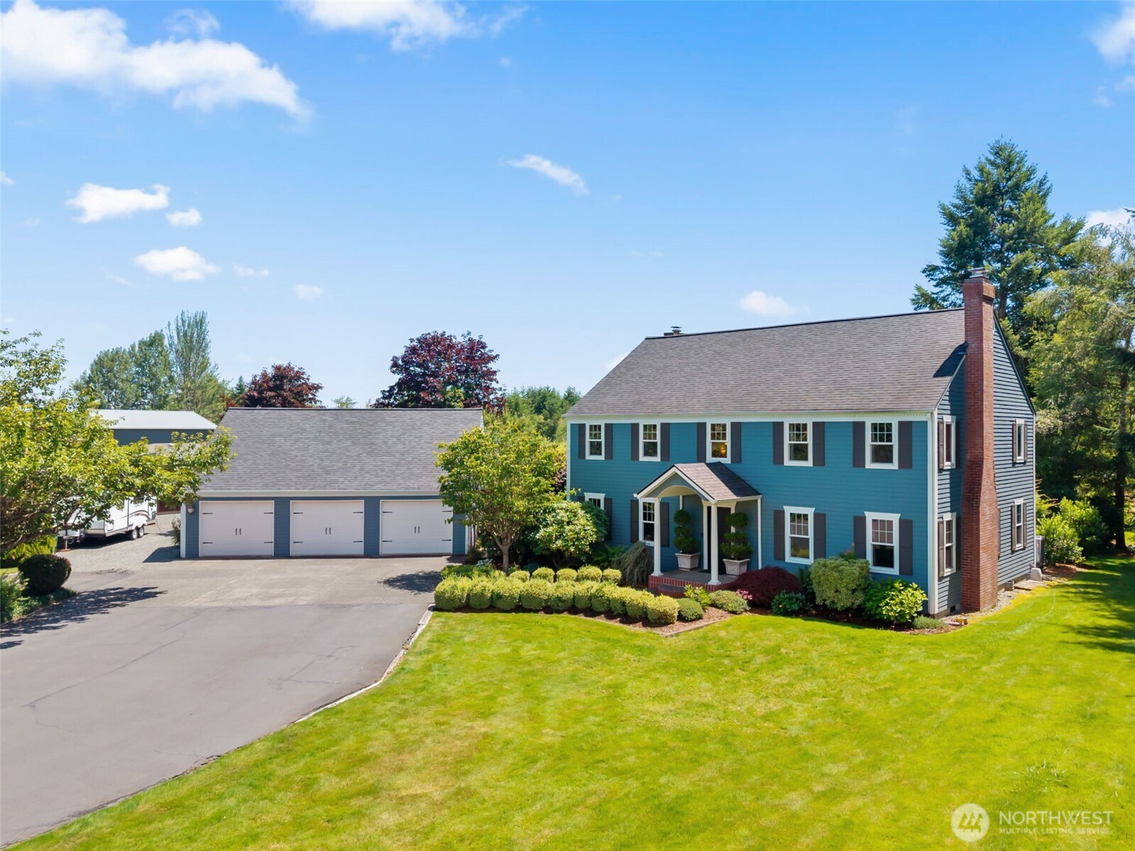 Beautifully maintained Classic Cape Cod home on 2.5 acres.  From the minute you pull in the drive the setting is inviting but wait till you see the back yard and gardens. Entering the home you can feel the warmth that says your HOME. Formal entry and woodwork are the beginning.  Formal living area with brick fireplace. Separate dining is perfect for large gatherings.Spacious kitchen with wall of windows flood area with natural light.  Large solid surface counters great for gourmet cooking and entertaining friends as they gather in the great room area.  large primary suite with 5 piece bath and large walk in closets.The 2nd floor bedrooms are large and welcoming  . The first floor bedroom can easily be office or den. Connected by breezeway is a 3 car garage plus workshop with 1100 sq ft bonus room with 1/2 bath. Step out the the rear patio door into landscapers dream patio. Custom designed water feature next to outdoor fireplace and huge paver patio that has hosted great summer parties and wedding gatherings. Care has been taken to blend in the orchard and fenced garden area the features blueberries and all their friends.  2nd firepit area is tucked in corner for private fun.The balance of the level acreage has more garden areas and natural plantings and trails. Could be home to horse or farm animals. Yes, you need to come view your  dream home.