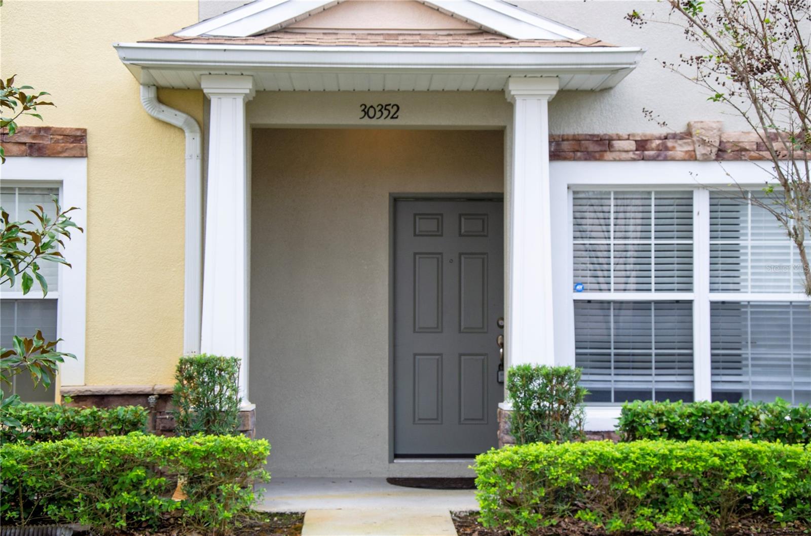 Welcome to this charming,  beautifully updated and spacious townhome located in the gated Hillhurst Crossing community within the highly sought-after Meadow Pointe neighborhood. Recently refreshed and newly painted, this home is truly move-in ready and prepared to impress.The expansive living room offers brand-new luxury vinyl plank flooring and includes a dining area that flows seamlessly into a versatile office or den.Upstairs, you’ll find two large master suites, each with its own private ensuite bathroom and ample closet space. A spacious bonus room separates the two bedrooms, making it perfect for a home office, playroom, or additional lounge area.Enjoy relaxing views from the screened-in lanai, which also includes a convenient storage closet.Residents of Hillhurst Crossing enjoy excellent community amenities, including a gated entrance, swimming pool, tennis and basketball courts, clubhouse, fitness center, and playground. Located in a top-rated school district, this home provides quick access to I-75, USF, downtown Tampa, Wiregrass Mall, Tampa Premium Outlets, Advent Hospital, Moffitt Cancer Center, and more.