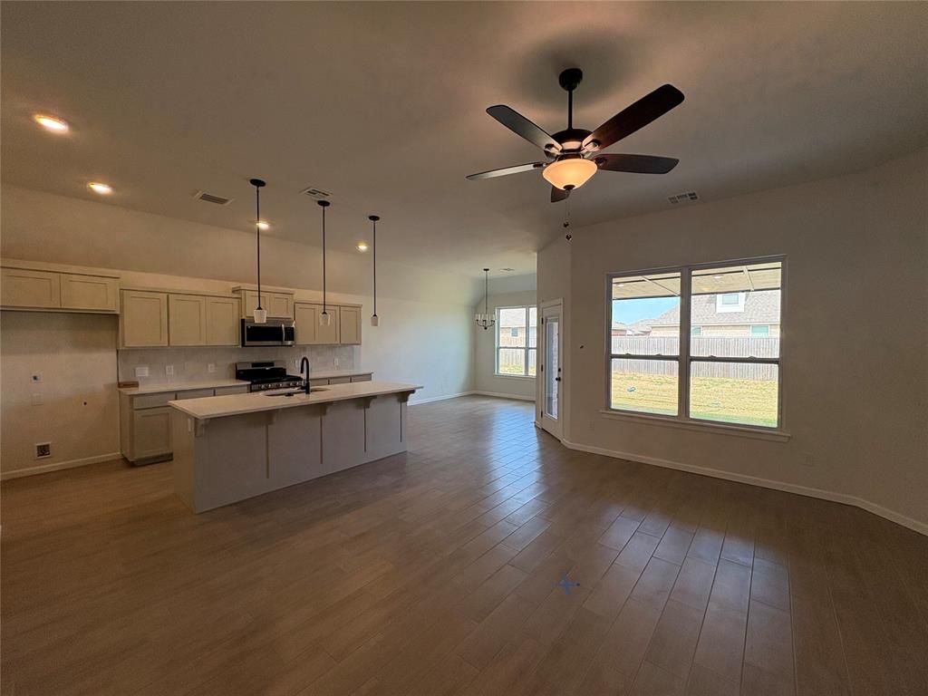 $35,000 Price Improvement Just Announced – Secure This Oversized Corner Homesite in the Newest Phase Today! Ready to move in, this home offers one of the most desirable corner lots and a floor plan designed to grow with your needs. With over 2,500 square feet of thoughtfully planned space and 3rd car garage, the Berkeley design blends comfort, flexibility, and style from top to bottom. Downstairs features three spacious bedrooms, including a private primary suite, and two and a half bathrooms. Upstairs, you'll find a fourth bedroom, a third full bathroom, and a large bonus room perfect for a game room, theater space, or creative studio. Whether your needs change over time or you just want more room to spread out, this layout adapts with you. The open-concept kitchen connects seamlessly to the living and dining areas and includes a large freestanding island, soft-close cabinetry, under-cabinet lighting, and stainless steel appliances. It's functional, stylish, and ideal for everything from casual meals to hosting guests. High-end finishes can be found throughout the home, including stainless steel appliances, quartz countertops, and wood-look tile in the main living areas. Every detail has been carefully chosen to create a home that is both timeless and livable. Built with long-term performance and energy efficiency in mind, this home includes structural upgrades rarely found at this price, including tornado safety features, a pre-piered foundation, Low-E Thermalpane windows, and a Navien tankless water heater. Homes like this don’t stay on the market long. Schedule your tour today and take the first step toward owning this exceptional home.