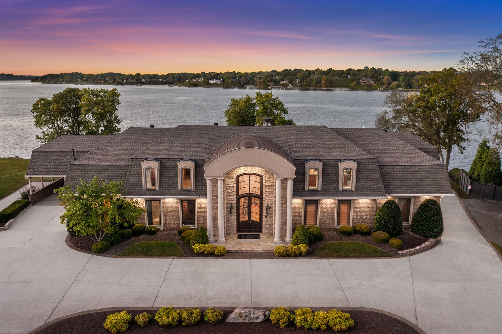 Welcome to 101 Kennett Rd, a breathtaking lakefront estate just 20 minutes from downtown Nashville. Nestled on the serene shores of Old Hickory Lake, this nearly 10,000-square-foot home offers an extraordinary blend of luxury, comfort, and effortless waterfront living in one of Middle Tennessee’s most desirable communities. The property features a RARE private boat ramp and dock with lift, providing unparalleled access to the lake for boating and water activities. Inside, you’ll find six spacious bedrooms and six bathrooms, designed with elegance and functionality in mind. The home includes an elevator for convenience and a huge basement ideal for family gatherings and entertaining. The primary suite offers stunning lake views and a spectacular custom closet, perfect for organizing in style. Step outside to a backyard oasis with a fenced-in Gunite salt water system pool, overlooking Old Hickory Lake, creating the ultimate setting for relaxation or hosting guests. Entertain with ease using the outside kitchen area with bar seating and granite bar top.Start of the art appliances that will come with this home include: sub-zero stainless steel refrigerator, Bosch stainless steel dishwasher, stainless steel ice maker, warming drawer, upright separate freezer, and convection oven/gas range. This is a rare opportunity to own a true waterfront masterpiece just minutes from the heart of Nashville.