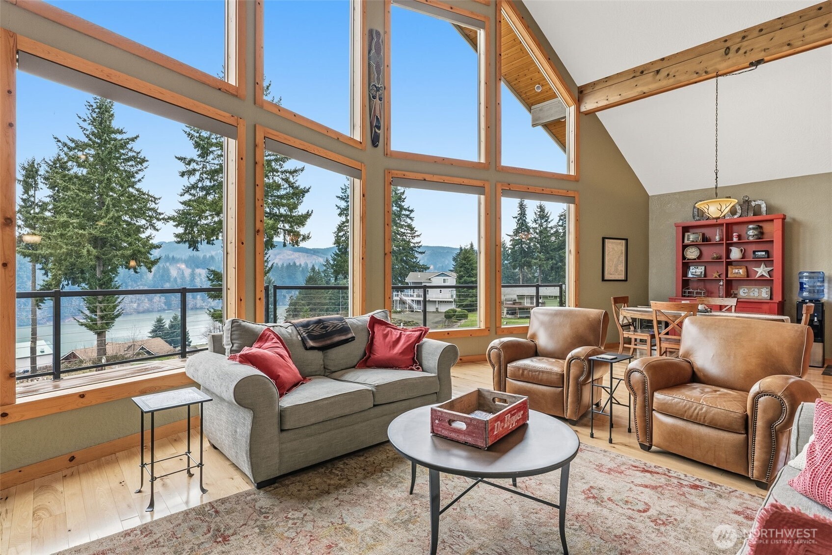 Discover your tranquil oasis in the picturesque Pacific Northwest, overlooking the breathtaking Mayfield Lake in Southwest Washington. This remarkable residence seamlessly combines comfort and recreation, making it ideal for year-round living, a serene vacation retreat, or a lucrative rental investment. Featuring a brand-new 50-year roof, this home ensures long-lasting durability and peace of mind. The open-concept floor plan bathes the living space in abundant natural light, creating a warm and inviting atmosphere. Step outside to an enchanting outdoor living area, complete with a custom firepit and full outdoor bar, perfect for entertaining gatherings in any season. With convenient RV parking and hookups, plus a separate bunkhouse for additional guests or rental opportunities, this property is designed for those who cherish outdoor adventures. Ample boat storage means quick access to the pristine waters of Mayfield Lake, with the potential for a private boat slip purchase. Nestled between Portland and Seattle, this location provides the perfect blend of urban convenience and small-town charm, offering easy access to outdoor activities at Mount St. Helens, Mount Rainier, and the White Pass Ski Area. Surrounded by stunning natural beauty and essential amenities, this turnkey, lake-view home is a rare find. Sold mostly furnished for your convenience, contact your preferred real estate advisor today to schedule a viewing and seize this unique opportunity.