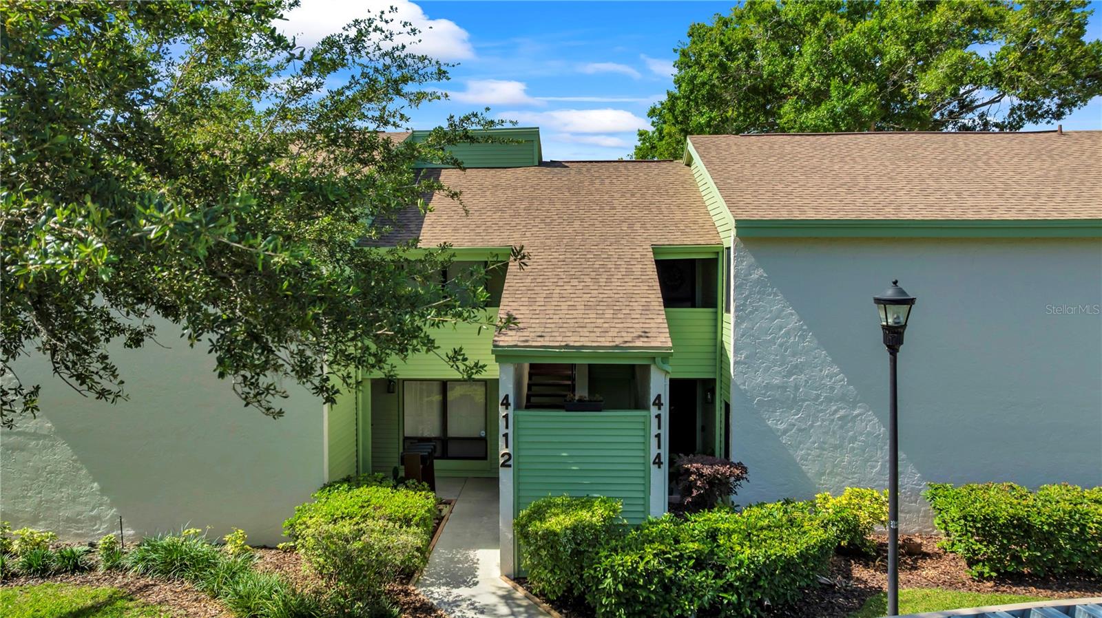 Welcome to effortless condo living in the heart of Carrollwood Village! This beautifully updated 2nd-floor residence at Pinelake offers a low-maintenance lifestyle with condo dues that include water, trash, cable, and WiFi, helping reduce monthly expenses while giving you more time to enjoy everything this sought-after community has to offer. Inside, the home showcases extensive upgrades and standout architectural details. Vaulted ceilings with an exposed accent beam create an open, airy feel, while the fireplace, framed by a custom mantle and stylish brick accent wall, adds warmth and visual appeal to the living space. The kitchen has been fully renovated with quartz countertops, updated cabinetry, backsplash, sink, and stainless appliances, complemented by luxury vinyl plank flooring. Additional improvements include updated interior paint, lighting, plumbing fixtures, and flooring throughout, along with the convenience of in-unit laundry. The primary suite offers new dual vanities and upgraded fixtures, while the guest bath has also been tastefully updated with a new vanity and fixtures. Residents enjoy access to a community pool, clubhouse, assigned covered parking, and a private storage unit, enhancing both convenience and everyday living. Significant building updates add peace of mind, including a roof replacement in 2019, exterior painting completed in 2026, and recently replaced chimney caps. Situated in a prime location, Pinelake is approximately 0.25 miles to Publix, 0.5 miles to N. Dale Mabry Highway, and close to Carrollwood Village Park, Carrollwood Country Club, and Carrollwood Cultural Center. With convenient access to Downtown Tampa, Tampa International Airport, area beaches, and Orlando attractions, you’re well-positioned for both daily living and weekend travel. Don’t miss the opportunity to enjoy the ultimate low-maintenance lifestyle in Carrollwood Village, schedule your private showing today!