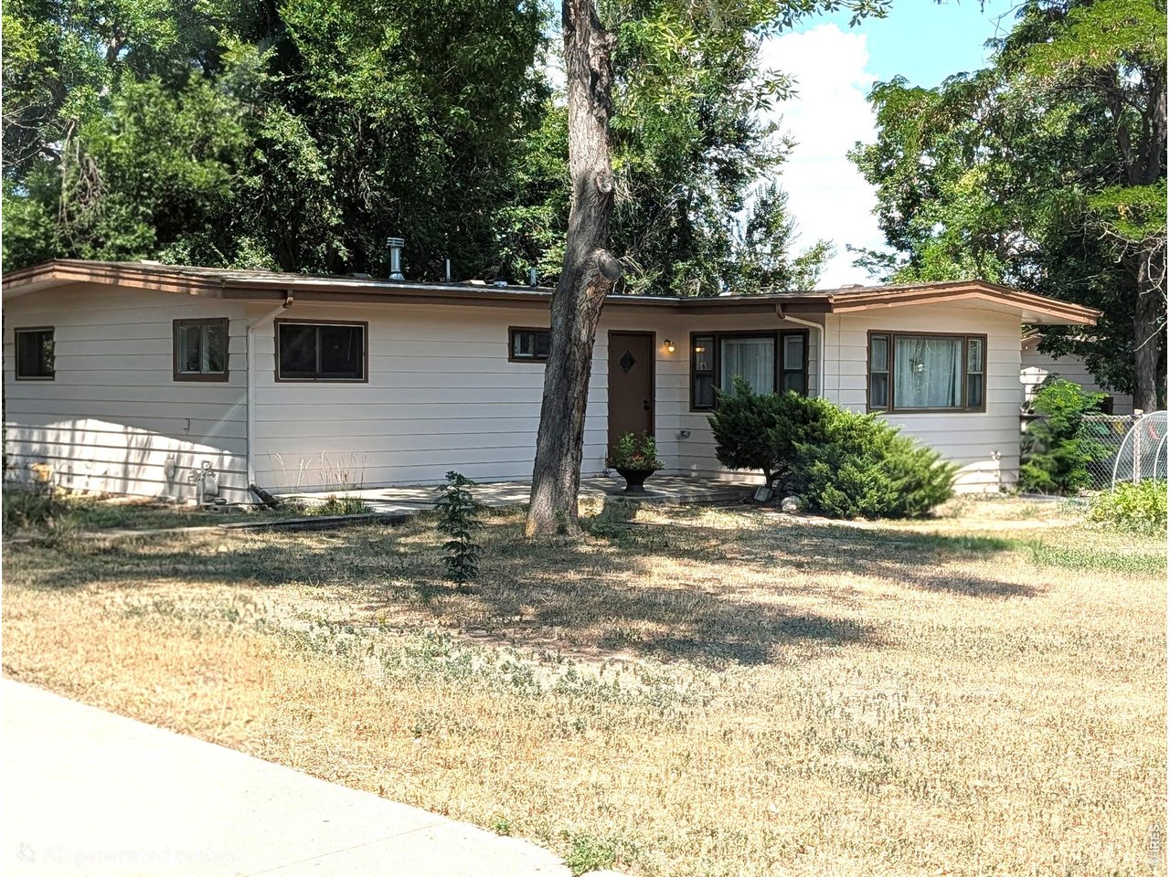 Well maintained ranch home with no HOA on a .44 acre corner lot. Originally built in 1884 but redone in 1922 and again in 1959, the current owners have recently refreshed it again with paint, flooring and brand new garage doors. Some original built-in details remain and lend character to the kitchen and main living/dining area. Large windows allow for lots of light! The primary suite is extra large because it used to be 2 separate bedrooms. Unfinished basement with laundry, storage room, mechanical room plus extra space to make your own. Garden beds, mature trees and a serene fenced yard with cozy firepit lend privacy away from the road. Leased through 12.31.2026.