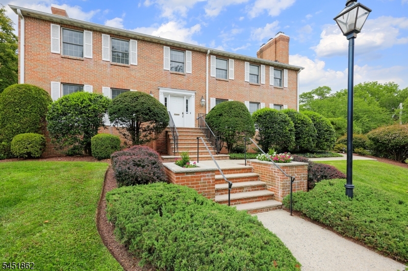 Completely renovated in 2021/2022, this spacious 2-bedroom, 2.1-bath end unit offers beautifully updated living space in an intimate five-unit complex. The inviting living room features a gas fireplace and flows seamlessly into the dining room, creating an ideal setting for everyday living and entertaining. The eat-in kitchen boasts stainless steel appliances, crisp white cabinetry, stone countertops, and access to the rear deck. The primary suite is a private retreat featuring a dressing area, walk-in closet, and beautifully appointed bath with marble shower and flooring, plus quartz countertops. A generously sized second bedroom offers ample closet space, while a full hall bath, powder room, and convenient laundry area complete the main living level. With windows on all sides, this desirable end unit enjoys abundant natural light and exceptional storage, including two lower-level storage rooms. A two-car garage and dumbwaiter providing convenient access to the unit add to the appeal. Best of all, the location is unbeatable just moments from vibrant downtown Westfield's shops and restaurants, the commuter train station, and top-rated schools. A rare combination of space, style, convenience, and location!