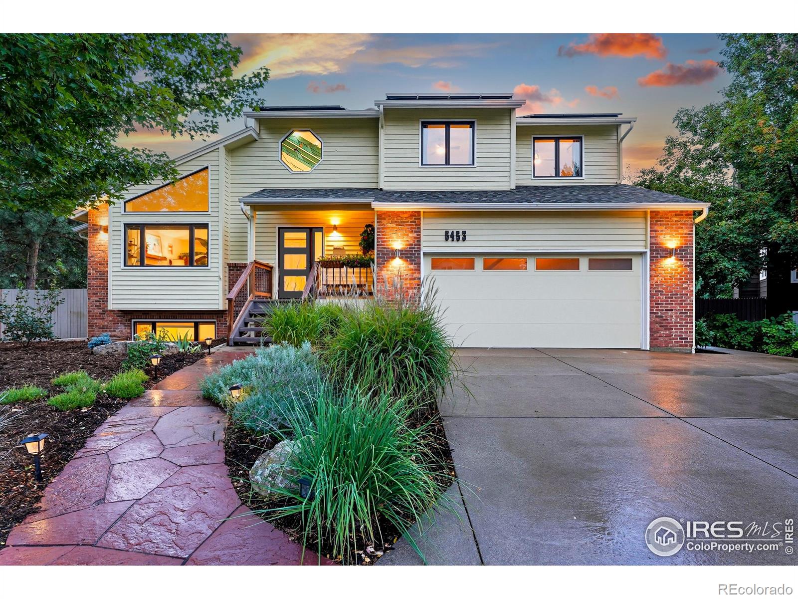 Perfectly tucked near the end of a quiet cul-de-sac in the heart of Greenbelt Meadows-one of East Boulder's most sought-after neighborhoods-this incredible home blends privacy, community, and access to open space. At the end of the street, a small neighborhood pocket park creates a welcoming green space where residents pass through on their way to nearby trails, open space, and community amenities. Thoughtfully updated throughout, the home features extensively remodeled kitchen and baths, gleaming hardwood floors, and a bright, vaulted open floor plan filled with natural light. The beautifully designed kitchen showcases KitchenAid and Bosch appliances, solid-surface countertops, a 5-burner gas range, a large pantry with slide-out shelving, and custom tile work. The inviting living room centers around a cozy fireplace and a large picture window overlooking the lush backyard. Recent updates include brand-new carpet, fresh interior paint, and extensive recessed (can) lighting throughout. Upstairs, the spacious primary suite offers dual closets and a five-piece bath with soaking tub and separate shower. The finished lower garden-level adds a fourth bedroom with a walk-in closet, a 3/4 bath, a recreation room, and generous storage-ideal for guests or a home office. Step outside to an expansive ~400 sq ft deck with pergola overlooking a private gardener's paradise. The front and back yards were fully reimagined in 2023 and feature mature trees, vibrant gardens, a large patio, and nine irrigated raised beds on a .21-acre lot. The oversized 589 sq ft garage includes built-in storage, and owned solar panels transfer free and clear for long-term energy savings. Greenbelt Meadows offers a neighborhood pool, hot tub, tennis and pickleball courts, basketball court, playground, and community park. Residents enjoy direct access to the Bobolink Trail, East Boulder Rec Center, and convenient access to US-36, Table Mesa, and RTD Park-and-Ride.