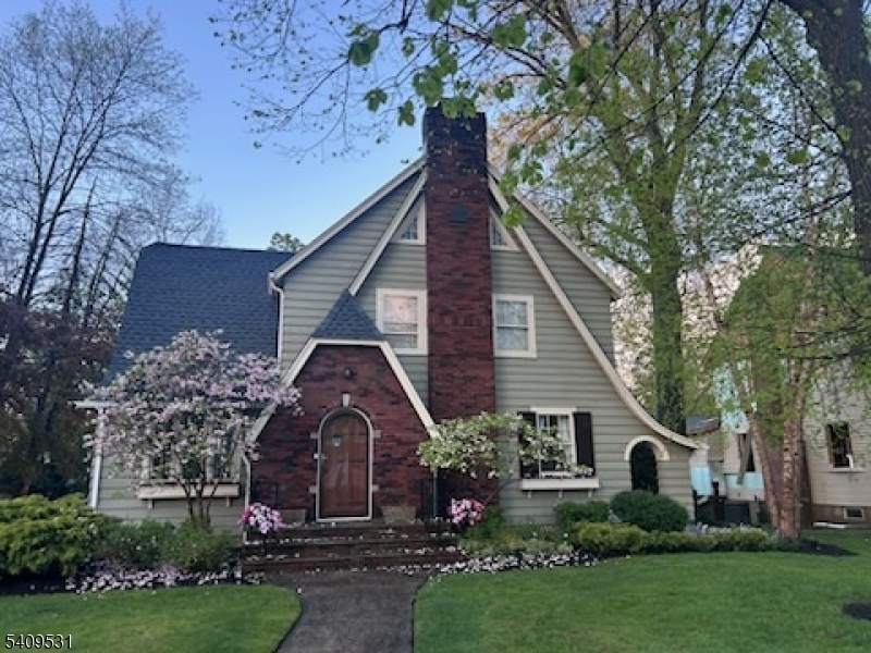 PROFESSIONAL PICS UPLOADING SOON. Sun-filled 4-bed, 3.5-bath English Colonial offering the perfect balance of old-world charm and sophisticated high-end finishes. Beautiful architectural niches, high ceilings, and character you simply can't replicate. The gorgeous kitchen features leathered granite countertops, a large center island, vaulted ceiling, and Viking range. The dining room showcases marble-topped cabinetry with a wet bar. Two en-suite bedrooms offer flexibility for a primary suite. Updated baths, new roof, updated systems, and CAC. The finished lower level offers a stylish lounge area and gym, highlighted by exposed brick and a cool, industrial edge. The impressive outdoor kitchen, patio, and expansive yard are ideal for entertaining. Set on a picturesque tree-lined street in one of Cranford's most beloved neighborhoods, zoned for BPS, OAS, and Cranford HS. Conveniently located near award-winning downtown Cranford and NYC transportation. Truly turnkey - simply move in and enjoy! This gracious home was featured in the Cranford Women's Club 'Home for the Holidays' House Tour.