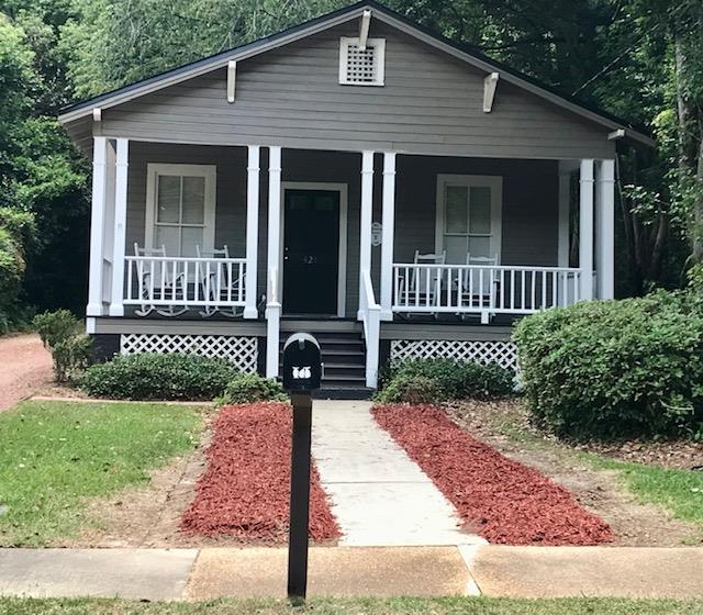 Step into a piece of local history. The Historic Massey House is now for sale. Built in 1925, this 2 BR, 2 Bath home offers 1248 square feet of warmth, charm and versatility. What sets this property apart is its flexible zoning, allowing for residential or commercial use. Whether you're searching for a primary residence, a professional office, boutique business or investment property, this one offers many possibilities. Conveniently situated near downtown, you'll enjoy easy access to shopping, dining, recreation and schools, placing amenities and community attractions just moments away. Schedule your private showing today.