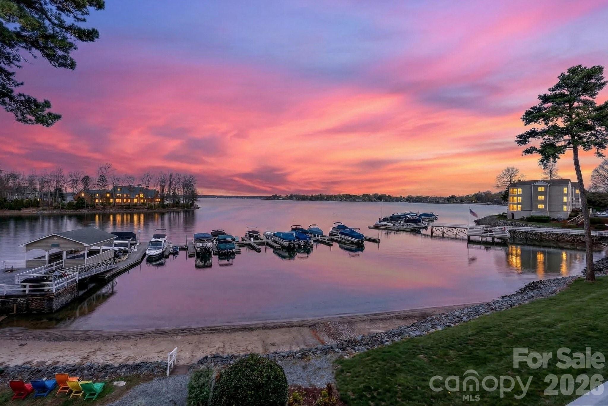 A RARE LAKE NORMAN OPPORTUNITY — CASH OR CONVENTIONAL FINANCING WELCOME, PLUS EXCEPTIONALLY FLEXIBLE SELLER FINANCING AVAILABLE WITH AS LITTLE AS 10% DOWN, A COMPETITIVE INTEREST RATE, AND PAYMENT OPTIONS DESIGNED AROUND THE BUYER'S NEEDS.Big-water views are among the most coveted perspectives on Lake Norman—and Residence #404 delivers one of the most breathtaking. Positioned in one of the few locations within the highly desirable Harborgate community where unobstructed sightlines stretch across the lake, this exceptional waterfront condominium captures approximately three miles of open-water views, creating a truly rare and dramatic backdrop for everyday living.Residence #404 is one of the select homes within Harborgate that enjoys this remarkable long-range perspective, offering sweeping panoramic water views from the main living areas and private balcony. From peaceful morning reflections to vibrant sunset skies, the ever-changing lake scenery becomes part of the experience of living here.Equally important for lake lovers, the property includes a deeded boat slip located just a short walk from the building, providing convenient access to Lake Norman.The interior has recently undergone significant updates designed to create a fresh, sophisticated, move-in-ready feel. The beautifully updated kitchen is complemented by gleaming hardwood floors, while the primary bathroom has been extensively remodeled with crisp, contemporary finishes and a striking new glass shower enclosure. The guest bathroom has also been refreshed with an upgraded vanity countertop and additional improvements. Together, these enhancements give the home a bright, polished appearance while maintaining the warmth and character of waterfront living.The open living and dining areas flow naturally toward the water, with expansive views creating an impressive focal point throughout the main living space. A wood-burning fireplace adds warmth and character, while the private balcony provides the perfect setting for morning coffee, evening cocktails, or simply watching life unfold across Lake Norman.The two-bedroom, two-full-bath floor plan offers comfortable single-level living with the rare combination of exceptional views, true lake access, a deeded boat slip, updated interiors, and a premier Cornelius location convenient to dining, shopping, entertainment, and everything the Lake Norman lifestyle has to offer.AND HERE IS THE OPPORTUNITY THAT TRULY SETS THIS PROPERTY APART: SELLER FINANCING IS AVAILABLE AS AN OPTIONAL ALTERNATIVE TO CASH OR CONVENTIONAL FINANCING. Qualified buyers may have access to a lower down payment, competitive interest rate, a 30-year amortization, and a customized payment structure ranging from interest-only to fully amortized. Seller financing also eliminates traditional lender points and loan origination fees and may eliminate the need for a lender-required appraisal—potentially saving thousands in upfront financing costs. Terms are negotiable and subject to seller approval.Few Lake Norman properties combine this caliber of view, direct boating access, recent updates, and financing flexibility in one offering. Residence #404 is ready for its next chapter.