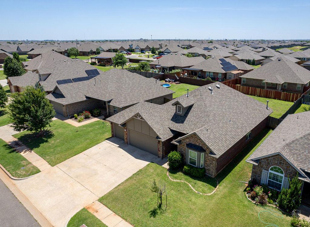 Welcome to Montague, where comfort, charm, and convenience come together beautifully! Step inside this stunning open-concept home and fall in love with the warm, inviting design. With a thoughtful split floor plan, each oversized bedroom offers the space you crave—plus walk-in closets for days! The heart of the home is the gorgeous kitchen, complete with rich granite countertops, a sleek stainless steel farmhouse sink, under-cabinet lighting, and custom maple cabinetry. The primary suite is your own personal retreat, featuring a spa-like bath with a garden tub, a tiled walk-in shower, and not one, but two spacious walk-in closets. Enjoy cozy evenings by the elegant cast stone fireplace or step outside to your upgraded covered patio, perfect for morning coffee or weekend barbecues. With wood floors, a 3-car garage, and top-tier energy efficiency (plus built-in tornado safety features), this home is as practical as it is beautiful. EV charger in garage. Back patio plumbed for spa. Tucked in a prime location with an Edmond address, Oklahoma City taxes and utilities, and Deer Creek schools—this home truly offers the best of all worlds.