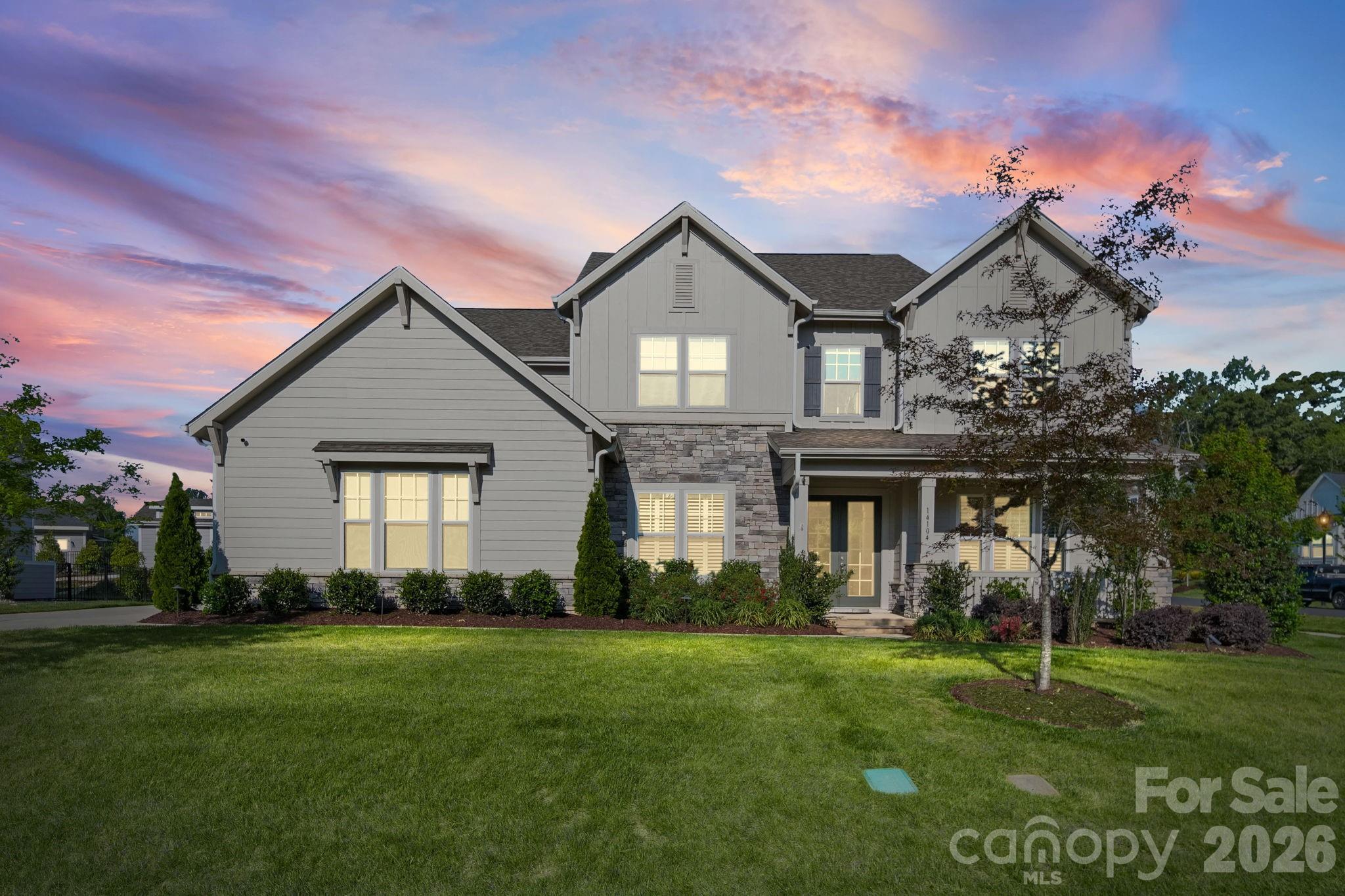 SELLERS WILL ENTERTAIN OFFERS BETWEEN $1,349,900.00-$1,399,900.00 OR ABOVE. This Gorgeous Custom Built Home is Situated on a Professionally Landscaped corner lot. Enter the home through the 8 Ft French Doors and you are Greeted with an Open Floor Plan that caters to an Entertaining Lifestyle. You will notice a Large Formal Dining Room off The Foyer as you make your way to the Huge Great Room Featuring a Custom Coffered Ceiling, Gas Log Fireplace, Lots of Windows with Custom Blinds, and Open to the Beautiful Gourmet Kitchen. The Kitchen is a Chefs Delight as it Features Custom Cabinets, Quartz Counter Tops, Custom Tile Back Splash, Stainless Appliances, FarmHouse Style Sink, Gas Cooktop with a Stainless Canopy Style Hood Vent, and Dual Islands with Eat-In Bar. As you enter the Dining Room from the Kitchen you will pass by the Beautiful Butler Pantry and the Powder Room is near for easy by your guests. The small Office/Computer Niche Room off the Kithen Features Built in Cabinets across from the Large Walk-In Pantry. The perfect area for planning meals or sorting mail so as to keep the Kitchen Free of Clutter. This Perfect Floor Plan Features a Main Level Bedroom En-Suite. The Huge Owners Suite is located on the Upper Level Featuring a Sitting Area and a Beautiful Glamour Private Bathroom with His and Hers Separate Vanities and His and Hers Separate Walk-In Closets. The upper Level also Boasts 3 other Guest Bedrooms, One of which is an En-Suite with Private Bath. The other 2 have Access to The Jack and Jill Bath. The upper Level also has a Laundry Room with Built in Cabinetry and Includes an almost New LG Washer and Dryer. The Large Bonus Room Features many Windows with Custom Blinds and a Wet Bar with space for a Beverage Wine Cooler. The Covered Wrap Around Rear Porch Features a Floor to Ceiling Outdoor Stone Gas Log Fireplace and Overlooks the Professionally Landscaped Rear Yard. There is Also a Large Stone Paver Patio off the Rear Covered Porch Area. The Home Comes with a Water Filtration System and a Tankless Water Heater. One of the Greatest Benefits of this Wonderful Home is the very hard to Find 4 Car Garage. Lots of room for Cars and or a Workshop.