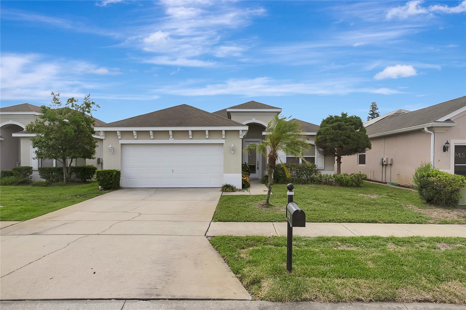 * Some photos are virtually staged. Welcome to maintenance-free living at its finest in the highly sought-after gated community of The Highlands!This beautifully maintained 3-bedroom, 2-bathroom home with a spacious 2-car garage offers nearly 2,000 square feet of bright, open living space designed for both comfort and entertaining. From the moment you enter through the impressive glass front door, you'll be greeted by soaring ceilings, abundant natural light, and an inviting open-concept floor plan that feels both elegant and welcoming.The expansive living and dining areas flow seamlessly into the heart of the home—a spacious kitchen featuring abundant cabinetry, generous counter space, a large breakfast bar, pantry storage, and a casual dining area perfect for everyday living. The adjoining family room creates an ideal gathering space for family and friends.One of the home's standout features is the seamless indoor-outdoor living experience. Multiple oversized sliding glass doors open to a screened lanai, creating the perfect setting to enjoy Florida's beautiful weather year-round, whether you're relaxing with your morning coffee or hosting evening get-togethers.The private owner's suite serves as a peaceful retreat, offering a spacious bedroom, large walk-in closet, dual vanities, a garden tub, and a separate walk-in shower. The split-bedroom layout provides privacy for family members and guests alike.Additional highlights include volume ceilings throughout, an interior laundry room, generous storage, and a thoughtfully designed floor plan that maximizes both space and functionality.Residents of The Highlands enjoy exclusive access to a private community pool and the convenience of a low-maintenance lifestyle. The HOA fee includes lawn care, irrigation, exterior pest control, basic cable service, and community amenities, allowing you more time to enjoy everything Florida living has to offer.Ideally located near shopping, dining, parks, beaches, and major commuting routes, this exceptional home offers the perfect combination of privacy, convenience, and carefree living.Don't miss this opportunity to own a beautiful home in one of the area's most desirable gated communities. Schedule your private showing today!