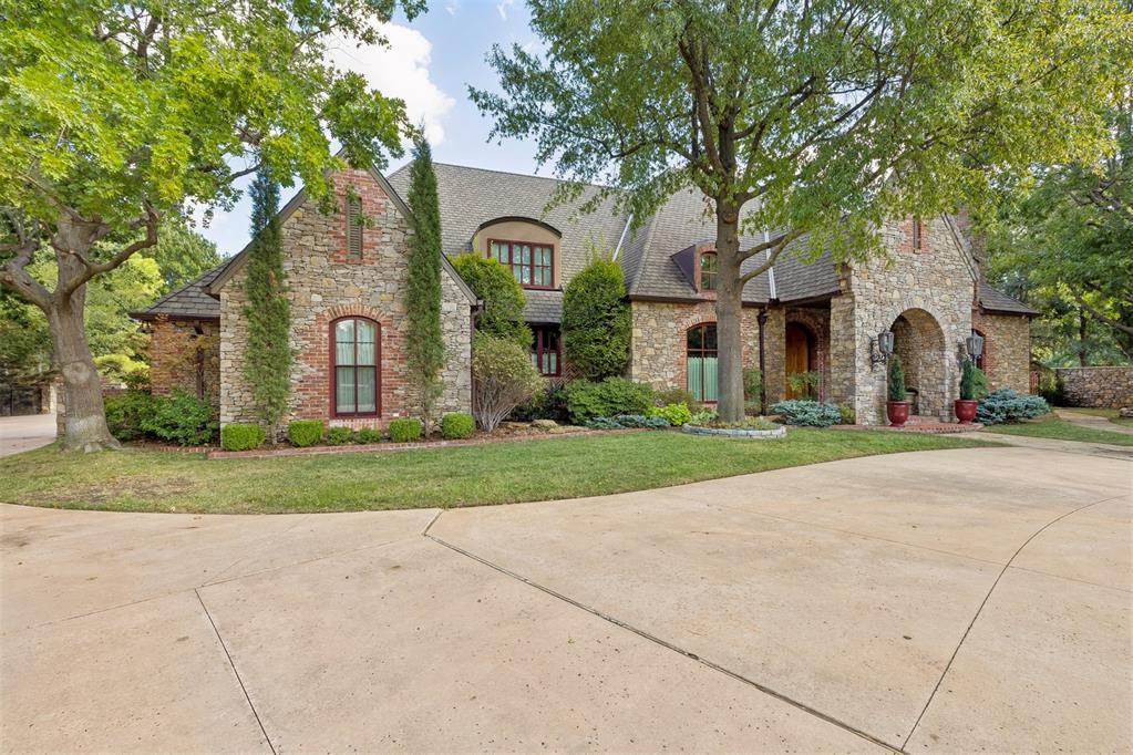 Showcasing timeless craftsmanship and generous living spaces, this beautiful Fairview Farm home welcomes you through double oak front doors into interiors finished with rich hardwood floors, solid-core doors, limestone and granite countertops, oak cabinetry, stacked-stone features, stone fireplaces and extensive woodwork.The gourmet kitchen features new appliances, including a Sub-Zero refrigerator, two dishwashers, double ovens, a food warmer and microwave. It also offers double islands, a cooktop set in a brick alcove, a full butler’s pantry and a walk-in pantry. The kitchen adjoins a breakfast room and a fireplace den. A sunken bar with limestone countertops connects the formal living and dining rooms with the breakfast room, creating an inviting layout for entertaining.The spacious primary suite includes a fireplace and sitting area, his-and-her bathrooms connected by a walk-in shower, his-and-her closets and a spa tub. An additional guest bedroom is on the main level; upstairs are three more generously sized bedrooms, each with an ensuite. The upstairs playroom features a drink refrigerator and sink, with space for play, exercise or hobbies.A large utility room offers abundant storage and a granite worktable with drawers. Outside, enjoy a 1.359 acre tree-lined yard, a 65-foot lap pool and ample shade for relaxing, play or entertaining. Please see the feature sheet in the supplements for the complete list of features and updates.