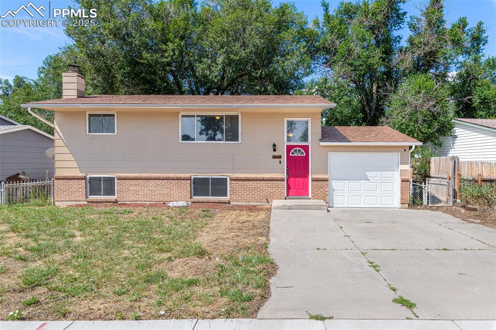 This Four bedroom, 2 bath home has the perfect floorplan with a large wrap around porch and mature trees in the large backyard. As soon as you walk in you'll notice how bright and welcoming this home is.  The entry way flooring and stairs have been freshly updated to include a brand new spindles!  The upper level Family room is spacious and has a ceiling fan and nice large window to the front of the home!  The kitchen is large, granite countertops, lots of counter space and room to add an island and access to a wrap around back patio and balcony.  Two good size bedrooms on the upper level one with a walk in closet.  Furnishings can stay if you'd like.  Upper level has an updated bathroom.  Plenty of storage throughout.  The lower level has a living space with the possibility of adding a little kitchenette.  The wood burning fireplace could really be painted a better color.  There is s second fridge and the washer and dryer can stay.  Both of bedrooms are good sized, in good shape and the Bathroom was recently updated as well!  This home is a great way to begin building equity. This home still needs some love and with your personal touch you can own a great house in a great neighborhood.   Great bones just needs a new start in life!