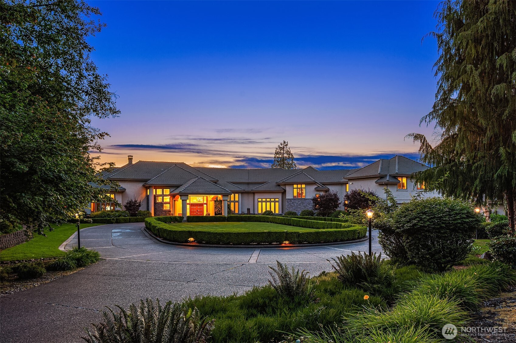 Experience Luxury Waterfront Lifestyle at Snag Island. Breathtaking private island estate ravishing in pure opulence. Magnolia lined gated entry lead to grand circular porte cochère w/extensive parking & 7+ car garage/shop. Hand-picked architectural details from the finest materials of the century, this shy 11,000 SqFt legacy residence opens to grand spiral staircase & Juliet balcony. An entertainer’s dream; perfect mix of sophisticated & casual spaces w/panoramic lake views from every room. 2nd staircase lead to 1bd/1ba Additional Dwelling Unit (ADU/MIL) w/full-kitchen & in-unit laundry. Accessibility features, including stair lift, enhance long-term livability; a rare generational waterfront residence offering scale, privacy & irreplaceable shoreline. Includes 2-tax parcels totaling 5.25 acres of rare north-eastern facing waterfront, offering 1,370' Lake Tapps peninsula: one of the largest private shoreline holdings in Pierce County. Lavish grounds w/spectacular sunsets feature sports court, in-ground pool & hot tub. At the water’s edge: covered lift, private boat launch & beach. Award-winning Dieringer School District. 24-hour guarded island access & guard house.