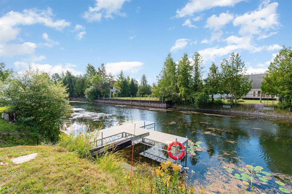 NEW AC, water heater, and heating system.This channel-front home offers direct access to Lake Huron, a private dock, and a proven short-term rental history. With 3 bedrooms, 2 bathrooms, and 1,900+ finished sq ft, it's sold fully furnished and currently operating as a successful, cash-flowing Airbnb--ready to continue as an investment or be enjoyed as a personal summer retreat.Outdoor living is a key feature, with a large back deck overlooking the channel and an upper-level primary suite with a private balcony--ideal for morning coffee or evening downtime. Easy boating access, strong rental appeal, and major mechanical updates already completed make this a low-maintenance, high-utility waterfront property.