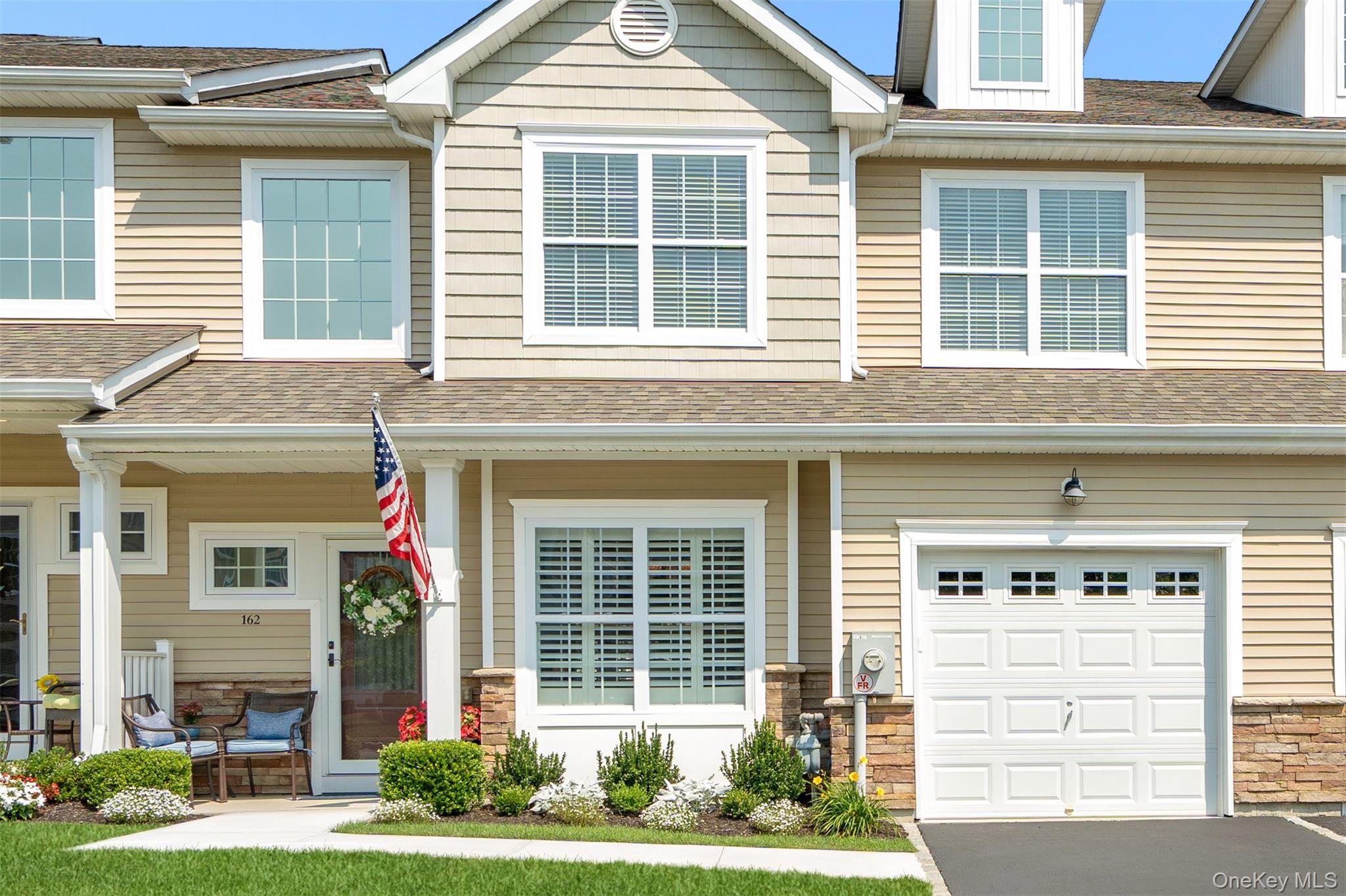 Immaculate and highly sought-after Corsica model in the gated 55+ Vineyards at Blue Point community, offering over 2,300 sq ft of luxury living in a premium location with tranquil pond views and close proximity to the pool and clubhouse. Thoughtfully designed, this home features an inviting two-story entry foyer and a modern open floor plan with hardwood floors, 9-foot ceilings, central air, gas heat and hot water, and a living room with soaring ceilings and a gas fireplace. The main level offers everything you need: a formal dining room, eat-in kitchen with granite countertops, stainless steel appliances, gas cooking, and center island, a living room, a hall bath, convenient laundry, and a spacious primary suite with tray ceiling, walk-in closet, second closet, and large en-suite bath. Upstairs includes a generously sized family room, guest suite, full bathroom, and additional storage. Outside, relax on your beautiful paver patio with retractable awning and enjoy the view of the pond and fountain. The professionally landscaped grounds create a serene setting, perfect for enjoying the outdoors. Additional features include a spacious full basement with egress window, attached garage, plantation shutters, and numerous custom upgrades. Residents enjoy resort-style amenities including a stunning clubhouse with great room, kitchen, gym, TV and game rooms, heated pool, bocce courts, fire pit, BBQ area, and more. Conveniently located near beaches, shopping, restaurants, highways, train, and airport—everything Long Island has to offer…a true must see.