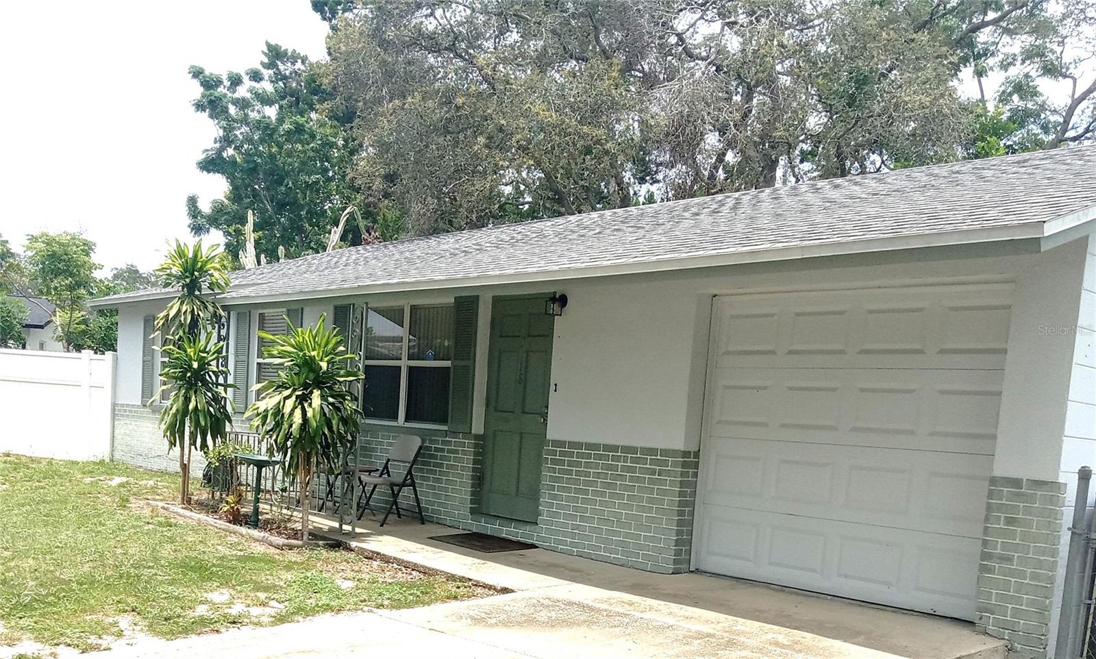 A GORGEOUS SLICE OF PARADISE AWAITS YOU AT THE HIGHLY DESIRED DUNEDIN IN FLORIDA! 
It is settled in a quiet cul-de-sac and it’s MOVE IN READY! It has 3 Bedrooms and 2 Bathrooms, OERSIZED garage and a FULLY FENCED LARGE BACKYARD! It is CONCRETE BLOCK, built to last with NO HOA and NO FLOOD insurance required! PERFECT FOR YOUR NEW PERMANENT RESIDENCE, VACATION HOME OR UNLIMITED RENTAL INVESTMENT with NO RENTAL restrictions!  NEWLY RENOVATED, it features: Open floor plan living and dining area, BEAUTIFUL KITCHEN with Granite Counter Tops, Stainless appliances and Custom hard wood Cabinets! 
This home is equipped with a NEW A/C and Heating 2022, NEW roof 2019, NEW electrical panel, NEW oversized Washer and Dryer and plenty of other upgrades! 
Bring your family and friends to enjoy indoor and outdoor entertainment with 2 patios and built in barbeque!  It is close to shopping, FANTASTIC beaches, Honeymoon Island, Treasure Island, Caladesi Island, Palm  Harbor, Safety Harbor and more!!! It has the best schools in the area, close to medical clinics, major hospitals, and two International Airports!!! Come see it today!