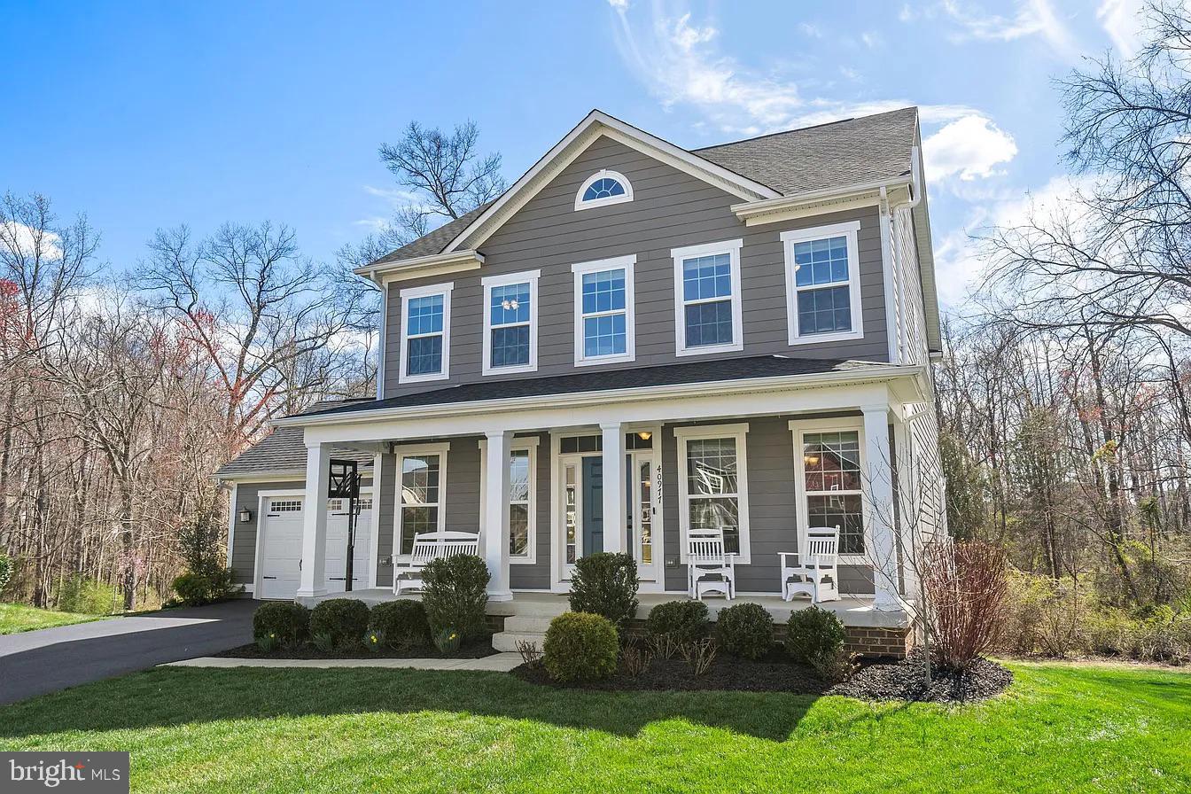 Beautiful Craftsman-style home featuring one of Willowsford's most sought-after floor plans. The gourmet kitchen showcases an oversized granite island that opens to a sun-filled morning room with a wall of windows, while the family room offers a gas fireplace and abundant natural light. The main level also includes a bedroom with access to a full bath and a separate room ideal for a home office.The upper level features four spacious bedrooms, including the primary suite, along with a conveniently located laundry room. The thoughtfully designed layout offers comfort and privacy for all bedrooms, enhanced by abundant natural light throughout the upper level.Designed for entertaining, the finished basement features a built-in bar and dedicated home theater with surround sound speakers and screen included in the sale, creating the perfect setting for movie nights, game days, and casual gatherings with family and friends.The backyard is a true natural retreat, backing to mature trees that provide exceptional privacy and peaceful views year-round. Enjoy outdoor living on the Trex deck, custom stone patio, and built-in fire pit, all seamlessly connected to the walkout lower level. Additional highlights include whole-home Bluetooth audio with speakers extending to the deck, a Nest security system with exterior cameras and video doorbell, smart sprinkler system, and ample parking on a quiet cul-de-sac.Recent updates include carpet replacement on the upper level and basement, along with a full interior repaint completed in 2023. Appliances including the microwave, dishwasher, and refrigerator were also replaced in 2023.