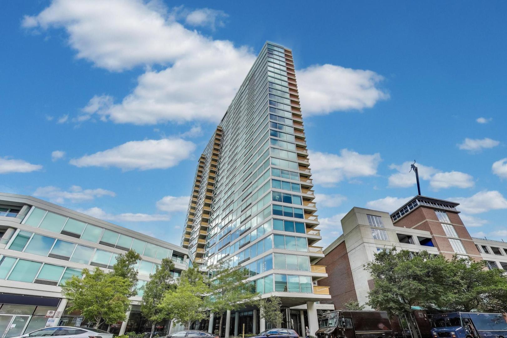 Welcome to this spacious, move-in ready 886 sq. ft. north facing "Tier 60" condo with sweeping, unobstructed views of Lake Michigan, stretching north, east, and west. Watch the seasons transform right from your home. This beautiful residence is the largest of its kind and rarely comes to market, featuring brand-new pergo flooring throughout, fresh professional paint, new stainless steel kitchen appliances, granite countertops, luxury custom closets, and updated lighting. The versatile floor plan allows for both casual dining in the crisp white kitchen or a designated dining room setup. Enjoy the beautiful views on the balcony, perfect for grilling and entertaining. The large primary bedroom easily accommodates a home office or cozy sitting area with breathtaking views. The updated bath includes a walk-in shower, and the convenience of in-unit laundry makes everyday living a breeze. Building amenities elevate your lifestyle with a 24-hour doorman, indoor pool, fitness center, and a newly refinished outdoor sundeck. Located in the heart of Evanston, you'll have theaters, shops, restaurants, and trains just outside your door. One assigned parking space (#41) and storage (#205) included. Investors are welcome, and the unit is available for immediate occupancy.  Don't miss this rare opportunity to own a move-in ready, view-filled home in one of Evanston's most sought-after buildings.