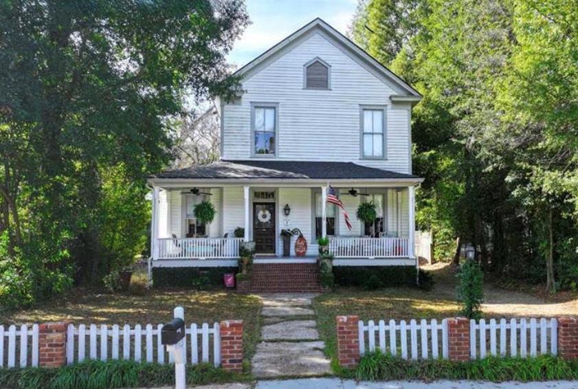 Walk to the bricks in Downtown Thomasville, Georgia. Welcome to the Henry Lester House — a truly iconic Victorian gem in Thomasville's beloved Dawson Street Historic District.  If you've ever dreamed of living in one of those charming, small-town scenes straight out of a Lifetime movie, this is it. From the moment you step onto the wide front porch — perfect for waving at neighbors cruising by on golf carts (because Thomasville is a golf-cart-friendly town!) — you feel the warmth and character that make this home so special.  Inside, gorgeous heart pine floors, tall ceilings, and four decorative fireplaces create that quintessential historic-home charm. The formal dining room sets the stage for unforgettable gatherings, while the updated kitchen blends modern convenience with uniquely appointed style.  The primary suite is on the main floor, featuring double vanities and a walk-in shower. Upstairs, the additional bedrooms are filled with natural light and served by a classic clawfoot tub — the perfect nod to the home's Victorian heritage. Additionally there is a smaller 4th room upstairs that would make a great nursery or office.  Step outside and you'll find a large fenced backyard complete with a detached pavilion for outdoor dining, morning coffee, or long conversations under the trees.  And the lifestyle? You're just steps from Downtown Thomasville. Walk to Grassroots Coffee, Jonah's, the amphitheatre, First Friday Sip & Stroll, the Rose Festival, and Victorian Christmas. The Big Oak, boutique shops, local restaurants, and schools are all just minutes away — making daily errands, school events, and nights out effortless.  Homes like this rarely come available. The Henry Lester House isn't just a place to live — it's a place to experience Thomasville at its very best. Seller may be willing to leave some furniture.