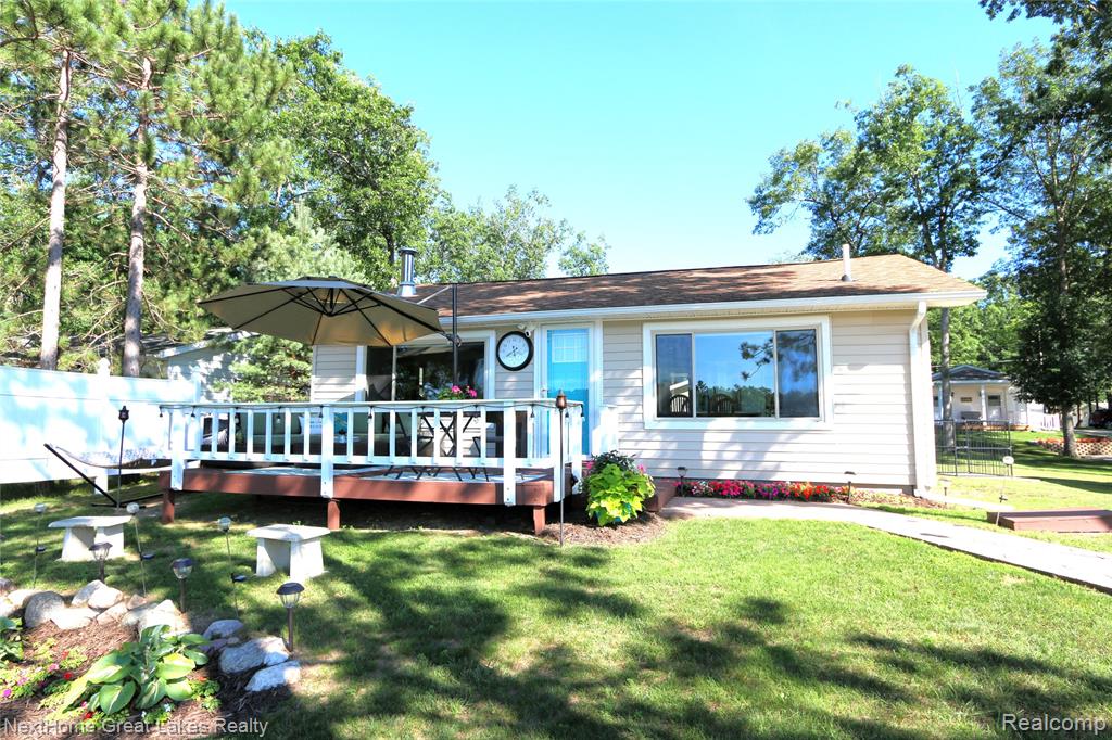 Welcome home to this well maintained and updated year round 2 bed, 1 bath cottage. Featuring 66 feet of sandy beach frontage and gorgeous views on all sports Little Island Lake. Completely remodeled to the studs in 2024. Updates include new well pump and bladder, HVAC, 50 gallon water heater, New electrical with 100 amp electrical service, plumbing, 1500 gallon septic tank and field, natural gas, gutters, Anderson windows, entry and storm doors, insulation, flooring, drywall, LED lighting, kitchen with quartz counters, stainless steel appliances, tile backsplash and laundry. New bathroom with custom tile shower. Outside enjoy the view from your deck or have some fun in the sun on your sandy beach in the lake and enjoy the stars in the evening at your lakeside fire pit! Detached 2 car garage with electricity. Extra deep lot with plenty of space to play, room for parking, storage and guests, stamped concreate sidewalk, concreate block retaining wall, wired for invisible fence and more! Too much to list! Option to purchase furnished, allowing you to move right in and enjoy the fun on day one! This fully renovated, inland lake home is just 15 minutes to downtown Tawas and close to the Huron National Forest, Sand Lake ORV/Snowmobile trailhead, Corsair ski trails and access to seven inland lakes for year round fun! One of the best lots on the lake where the view never gets old! Don't miss out on your chance to own this lakefront dream! Schedule your showing today!