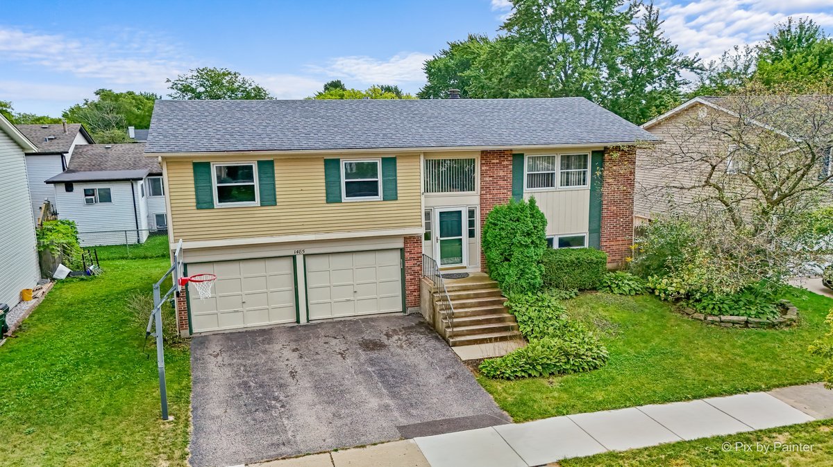 FREMD HIGH SCHOOL | 4 BEDROOMS | 2 FULL BATHS    Move right in and make it your own over time! Located in a desirable North Side Hoffman Estates neighborhood, this 4-bedroom, 2-full-bath raised ranch offers a flexible floor plan, valuable updates and room to build sweat equity with future improvements.    Step inside to fresh paint and a warm wood railing that adds character to the entry along with a bright and airy living and dining area. The updated kitchen features QUARTZ COUNTERTOPS, plenty of cabinet space, plus a newer stove and dishwasher (2025). On the lower level, enjoy a family room with fireplace and a 4th bedroom that provides flexibility to be used a home office, work-out room or play room.  A raised-ranch layout gives your family plenty of room to spread out.    Enjoy the outdoors from the freshly painted COVERED MULTI-LEVEL DECK, offering shade and plenty of space for relaxing, dining or entertaining. The manageable yard means less time spent on upkeep. An OVERSIZED GARAGE provides additional space and features updated garage doors and new remotes.    Several of the bigger-ticket items have already been addressed, including a ROOF APPROX. 5 YEARS OLD and CENTRAL AIR APPROX. 3 YEARS OLD.    LOCATION IS A STANDOUT. A neighborhood green space is just a couple of doors down, minutes from  Olmstead Park with baseball field, tennis courts, basketball court, Playground, paved trails and park shelter.  Students will attend the highly regarded FREMD HIGH SCHOOL. Enjoy HOFFMAN ESTATES PARK DISTRICT amenities along with convenient access to shopping, dining, forest preserves, golf, I-90 and O'Hare Airport.    Move in now, update as you go and make this home your own.