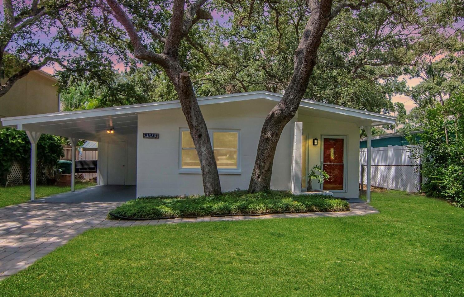 This cute-as-a-bug South Tampa abode proves that great homes can still be found at a price you can afford. Walkable to Bayshore Boulevard, it’s full of charm, convenience, and peace of mind—safely outside the flood zone and completely unaffected by last year’s hurricanes.
Step inside to a welcoming living and dining room combo with well-preserved terrazzo floors, flowing into an efficient kitchen and two comfortable bedrooms. The original 1958 bathroom maintains its vintage character with a newly reglazed tub and tile (2025).Outside, a convenient Utility room with washer/dryer, covered carport and  enjoy an oversized yard—a rare bonus in South Tampa—perfect for relaxing or entertaining. Hurricane-rated windows (2025) and fresh exterior paint (2025) add even more appeal.
From morning jogs along Bayshore Boulevard, to evenings exploring nearby South Tampa dining, shopping, and nightlife, this home puts you right in the center of it all. With durable block construction, thoughtful updates, and an unbeatable walkable location, this is a rare find.