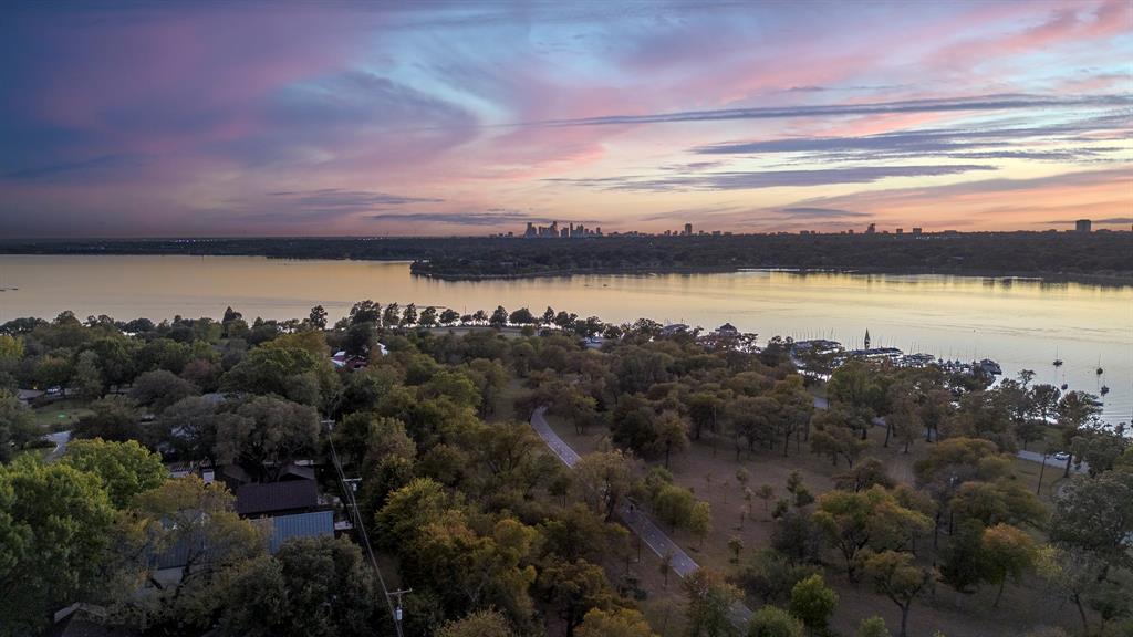 VIEWS,VIEWS, VIEWS! Wake up every day to the serene beauty of White Rock Lake and Park. This luxurious 3-story masterpiece offers 5 bedrooms, each with its own ensuite bathroom, plus 2 powder baths—providing ample space for family and guests.

Designed for versatility, the 3rd-floor game room can be converted into an additional bedroom, and the small garage offers yet another flexible option. Expansive, open-concept living areas make this unique home perfect for entertaining, while the gourmet kitchen, complete with high-end appliances and sleek modern finishes, will delight any chef.

Wine enthusiasts will appreciate the elegant glass wine room—an ideal showcase for your collection. With large windows throughout, the home ensures breathtaking views of the lake, park, or city are always within sight, creating a picturesque and tranquil backdrop for daily life.

This one-of-a-kind residence is set to be one of the best in Dallas, combining contemporary design with luxurious comfort. Expected completion is November 2025.

Discover the perfect harmony of elegance, design, and location in this extraordinary home. Explore all the features this stunning property has to offer!