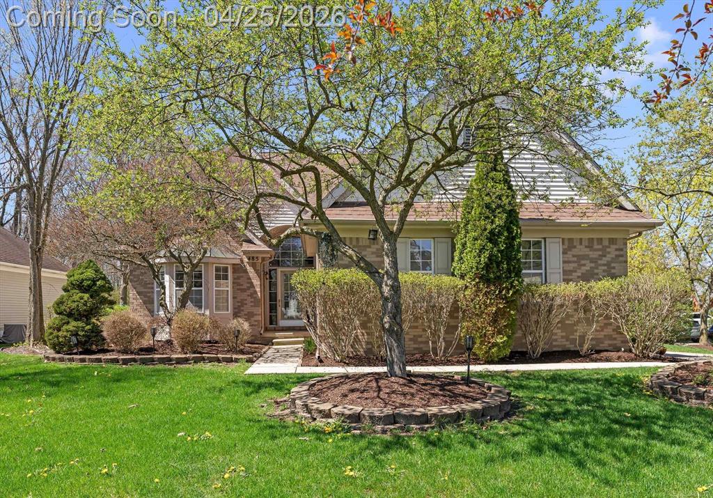 Beautifully maintained and move-in ready, this 3-bedroom, 2.5-bath home offers comfort, style, and privacy in one exceptional package. Featuring a highly sought-after first-floor primary suite with a full bath and additional full shower, the layout is both functional and inviting. Soaring ceilings and rich hardwood floors create an open, airy feel throughout, while the stunning living room-anchored by a cozy fireplace-adds warmth and character. The gorgeous kitchen is a true centerpiece, featuring beautiful wood cabinetry, ample space, and a layout ideal for both everyday living and entertaining. A dedicated library or home office provides the perfect work-from-home setup, and the convenience of first-floor laundry adds to the home's thoughtful design. Situated on a premium corner lot, the home backs to serene natural surroundings, offering a peaceful and private backyard retreat. Immaculately cared for and truly turnkey, this home reflects pride of ownership at every turn. Homes offering this level of space, features, and privacy at this price point are rare-schedule your private showing today.