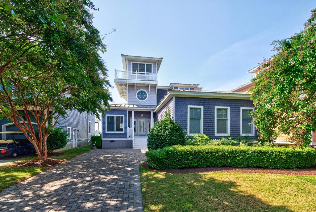 Welcome to the Purple Pelican, where coastal living comes with a little personality! This charming 4-bedroom, 2.5-bath coastal home with Chesapeake Bay water views is ready to help you trade ordinary days for salty breezes, spectacular sunsets, and a life lived a little closer to the Bay. Built in 2003, this comfortable coastal retreat offers an inviting, open-concept floor plan with light-filled rooms that create an easy, relaxed atmosphere throughout. A thoughtfully designed first-floor primary suite provides a private and peaceful retreat, complete with a large en-suite bath, generous closet space, and a convenient linen closet. The main level is designed for both comfort and functionality, making one-level living easy while still offering plenty of space for family and guests. Cathedral ceilings, generous cabinetry, and ample storage add to the home's appeal, creating a welcoming setting equally suited for quiet mornings, family gatherings, and entertaining friends. Upstairs, three nicely sized bedrooms provide comfortable accommodations for family, guests, or a home office. The spacious hall bath is thoughtfully designed for busy mornings and visiting guests, featuring a separate toilet area and vanity/sink area, allowing multiple people to use the space at the same time. The second floor provides a comfortable balance of privacy and functionality while keeping everyone close to the heart of the home.  Head upstairs to the third-floor crow's nest, a delightful bonus space complete with a small refrigerator and wet bar. It's the perfect spot for morning coffee, sunset cocktails, game nights, or simply taking in the coastal views. Step onto the west-facing decks and enjoy beautiful Chesapeake Bay water views, with front-row seats to some truly memorable sunsets. Outside, a fenced yard offers a wonderful space for outdoor enjoyment, pets, play, or simply relaxing in the coastal sunshine. A stone driveway leads to a spacious two-car garage with a purpose-built loft for extra storage—ideal for beach gear, bikes, kayaks, and all the treasures that come with enjoying the coastal lifestyle. And then there's the Bay Creek lifestyle. Members enjoy an impressive array of amenities, including tennis, new pickleball courts, pools, nature preserve trails, and a state-of-the-art fitness center with classes. Private community beach access makes it easy to enjoy endless beach days, peaceful walks, and gorgeous sunset views over the Bay. This property includes a sports membership and is offered partially furnished! The Purple Pelican offers the perfect blend of coastal charm, thoughtful living spaces, water views, and an enviable Bay Creek lifestyle—ready to welcome you home.