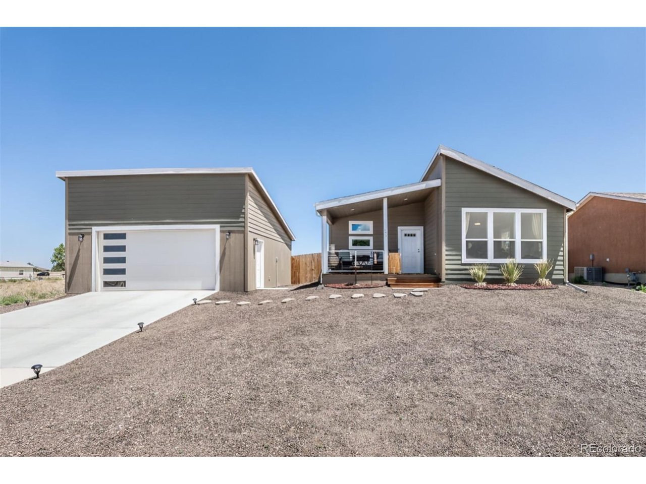 Home Warranty until 2030 and VA Assumable loan at 5.45%! Welcome home to this beautifully built 2023 rancher with 2 car garage in the heart of Pueblo West, where modern living meets breathtaking mountain views! The only thing you'll need to update is your address! Start your days sitting outside on the front porch with serene views of the mountains or in the evening watching the colorful sunsets. Step inside to a bright and airy living room filled with natural light from expansive windows that perfectly frame the stunning mountain scenery. The open-concept floor plan creates a seamless flow into the spacious kitchen, featuring a large island perfect for entertaining or meal prep. Coffee lovers will appreciate the dedicated coffee bar, creating the perfect morning routine space. The thoughtfully designed layout includes a conveniently located laundry room and a spacious primary suite that's truly a retreat. Relax in the oversized bedroom with its own sitting area that can be used as a flex area, enjoy the large walk-in closet, and unwind in the private en suite featuring dual sinks and a walk-in shower.Two additional bedrooms and a full hallway bathroom provide plenty of space for family, guests, or a home office. Outside, you'll love the 0.28-acre lot complete with a fully fenced backyard that is low-maintenance xeriscaping.