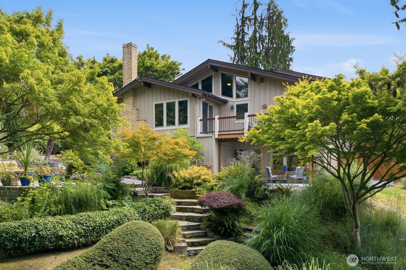 Experience the perfect blend of modern design & PNW beauty in this exceptional custom NW Contemporary home on stunning 12,197sf lot. Thoughtfully designed to complement its natural surroundings, it features cedar plank & beam ceilings, expansive floor-to-ceiling windows & skylights that fill home w/natural light & rich slate, stone, brick & other natural materials thru-out. Open-concept Great Room showcases striking stone fpl w/multi-level mantel & a custom built-in stone planter that brings nature indoors. Sliding doors open to spacious deck for seamless indoor-outdoor living. Chef’s kitchen offers granite slab counters, SS appl., cherry cabinetry, custom lighting, walk-in pantry & 2-sided breakfast bar. Spacious bedroom & full bath complete the main level. Upstairs, the private Primary Retreat features vaulted cedar ceilings, lrg walk-in closet, 2 additional closets, a spa-inspired ensuite w/dual sinks & lrg walk-in shower, plus private balcony w/breathtaking Sound views & sunsets. Downstairs boasts 2nd Primary Suite w/ensuite bath & private covered patio, ideal for multi-generational living. Outside, enjoy your park-like backyard sanctuary w/meandering pathways, mature landscaping & peaceful garden retreats. RV/Boat parking. Quiet neighborhood in Mukilteo School District w/easy access to schools, beaches, parks, Boeing, ferry, amenities & major commuter routes. Rare opportunity to own a distinctive NW Contemporary retreat where architectural elegance & natural beauty unite