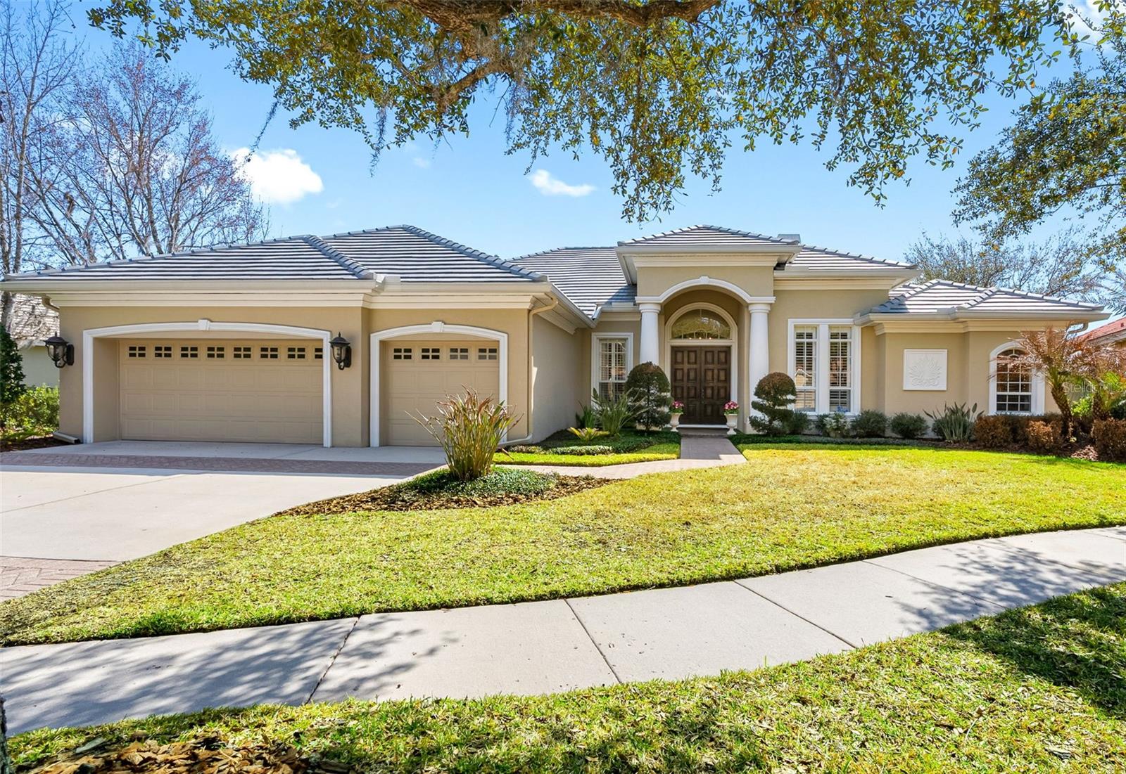 Under contract-accepting backup offers. Spectacular executive home located in the gated community of Lancaster in Tampa Palms, perfectly positioned on a private pond lot at the end of a quiet cul-de-sac. This Hannah Bartoletta–built Monterey III floor plan offers 4 bedrooms, 3 full baths, a private office, bonus room, and 3-car garage—all on one spacious level. A grand double-door entry welcomes you with travertine flooring that flows throughout the main living areas, complemented by soaring ceilings and abundant natural light. The formal living room features a gas fireplace and sliding glass doors leading to the outdoor living space. The dedicated office and primary suite are thoughtfully positioned for privacy. The primary suite offers serene pond views, private access to the pool, and two large custom closets. The luxurious en-suite bath includes dual granite vanities, a garden tub, and a walk-in shower. The updated kitchen is designed for both everyday living and entertaining, showcasing granite countertops, tile backsplash, gas cooktop, wall oven, butler’s pantry with wine cooler, and a spacious closet pantry. The kitchen opens seamlessly to the family room, where triple sliding doors lead to the screened paver lanai and pool area. Two secondary bedrooms share a full bath with dual granite vanities and tub. A separate rear guest suite features a private bath with walk-in shower and serves as a convenient pool bath. The expansive bonus room offers incredible flexibility—ideal for a game room, fitness space, media room, or potential in-law suite setup. Enjoy Florida living at its finest in the screened paver pool and lanai, complete with outdoor grill area and peaceful pond views. The 3-car garage features epoxy floors, and the extended driveway provides ample parking. Recent updates include: Roof (2026), Interior Paint (2026), AC units (2021 & 2022), and Water Heater (2022). Custom closets are featured throughout the home. Residents of Lancaster enjoy access to Club Tampa Palms, offering a clubhouse, resort-style pool, fitness center, tennis courts, and basketball courts. Conveniently located near USF, Moffitt Cancer Center, AdventHealth, Tampa Premium Outlets, shopping, dining, and major highways including I-75 and I-275 for easy access to downtown Tampa, Tampa International Airport, sporting venues, and the Gulf Coast beaches.