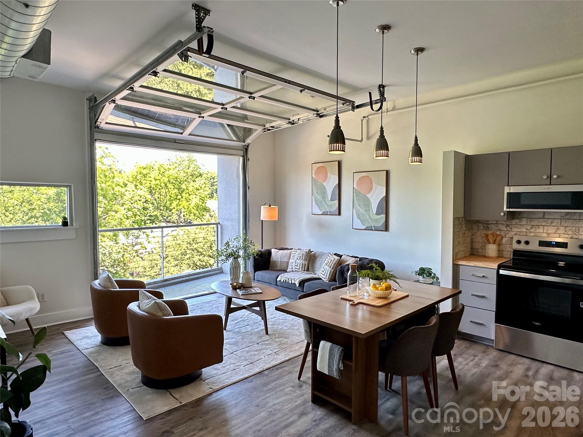 Located on the top floor of Central 27, this recently improved condo captures the unmistakable energy of Plaza Midwood with a design that feels both bold and effortless. Soaring 13-foot ceilings and exposed ductwork set the tone, while a full garage-style door opens from the main living space to a covered balcony, creating a seamless indoor-outdoor experience that’s as functional as it is striking.The open-concept layout is designed for the way you actually live, whether that’s hosting, unwinding, or working from home. The kitchen has been thoughtfully updated with butcher block countertops, brand new stainless steel appliances, and a tiled backsplash that ties together the modern gray cabinetry with a clean, cohesive aesthetic.The newly upgraded bathroom delivers a fresh, curated feel with a tiled walk-in shower, updated vanity, and a walk-in closet that adds everyday functionality.Access is effortless with elevator service directly from the parking deck, and once you’re home, everything Plaza Midwood is known for is right outside your door. Local coffee shops, standout dining, eclectic retail, and a nightlife scene that keeps the neighborhood alive. The greenway, nearby parks, NoDa, and Uptown are all just minutes away.Short-term rentals are permitted with a minimum stay requirement, offering flexibility for those considering part-time use or an investment opportunity.This is not just a condo, it’s a front-row seat to one of Charlotte’s most dynamic neighborhoods.